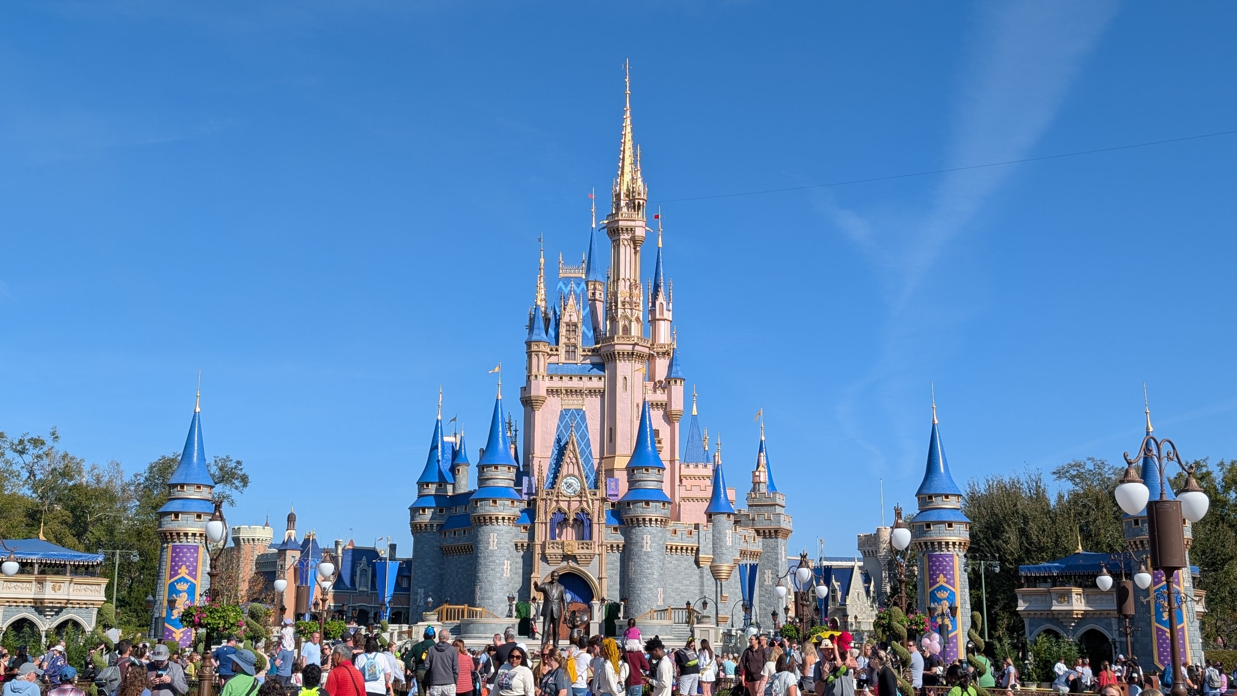 Walt Disney World Magic Kingdom Cinderella’s Castle with a crowd Walt Disney World Magic Kingdom Cinderella's Castle with a crowd