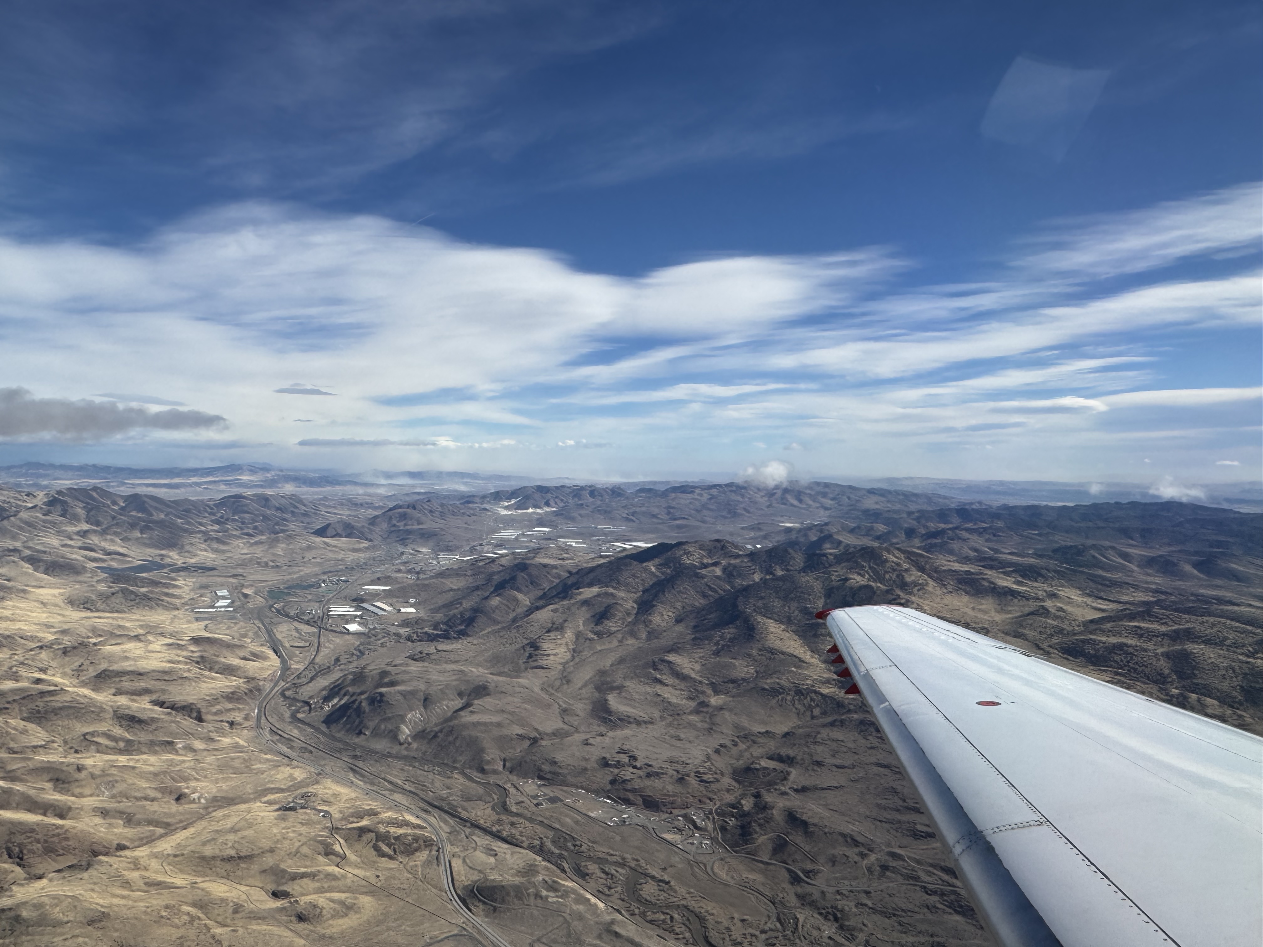 Wing and window view from JSX Embraer ERJ135 plane Wing and window view from JSX Embraer ERJ135 plane