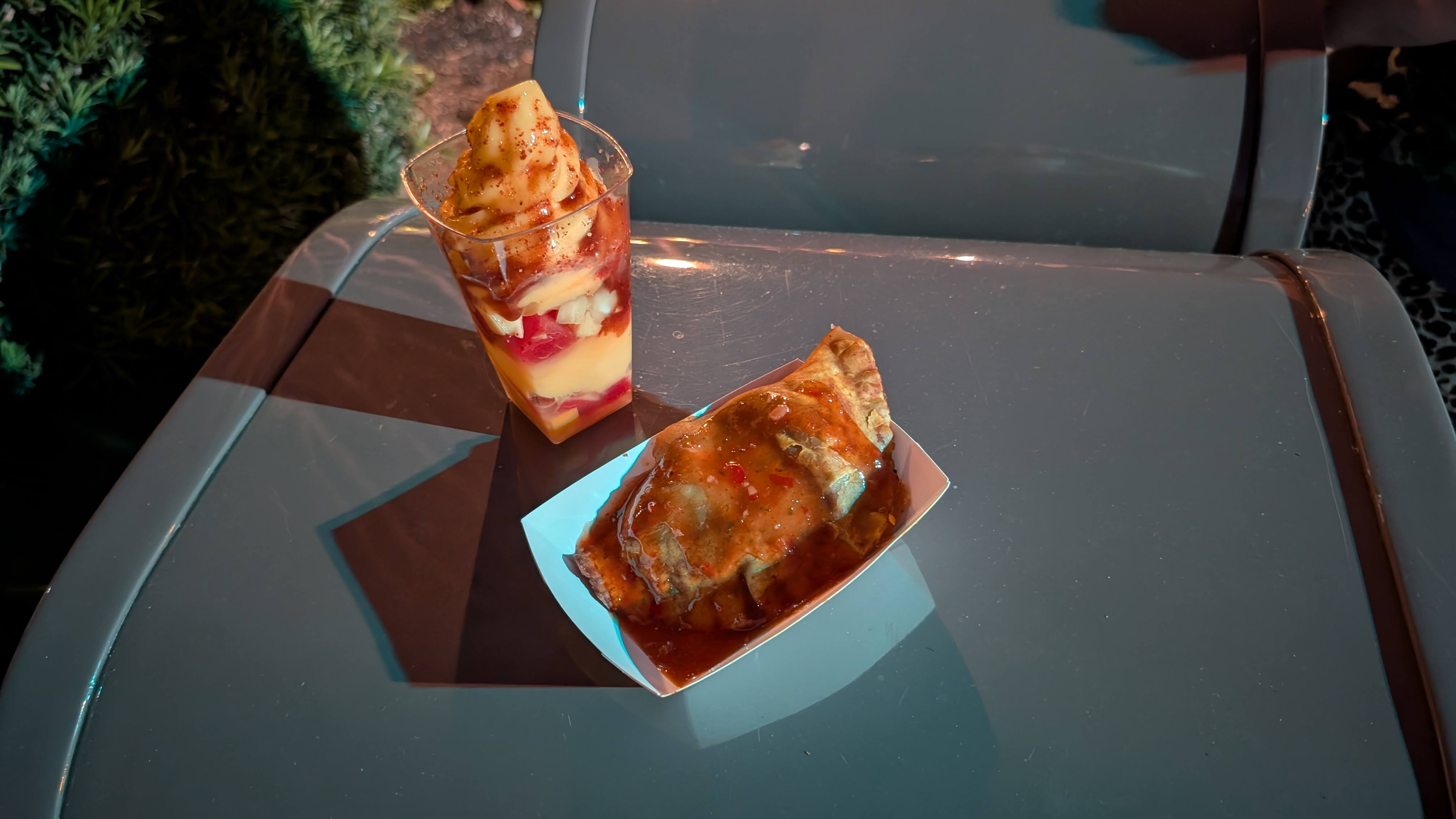 Epcot Flower and Garden Festival food Refreshment Outpost Jamaican beef patty and seasonal fruit parfait Epcot Flower and Garden Festival food Refreshment Outpost Jamaican beef patty and seasonal fruit parfait