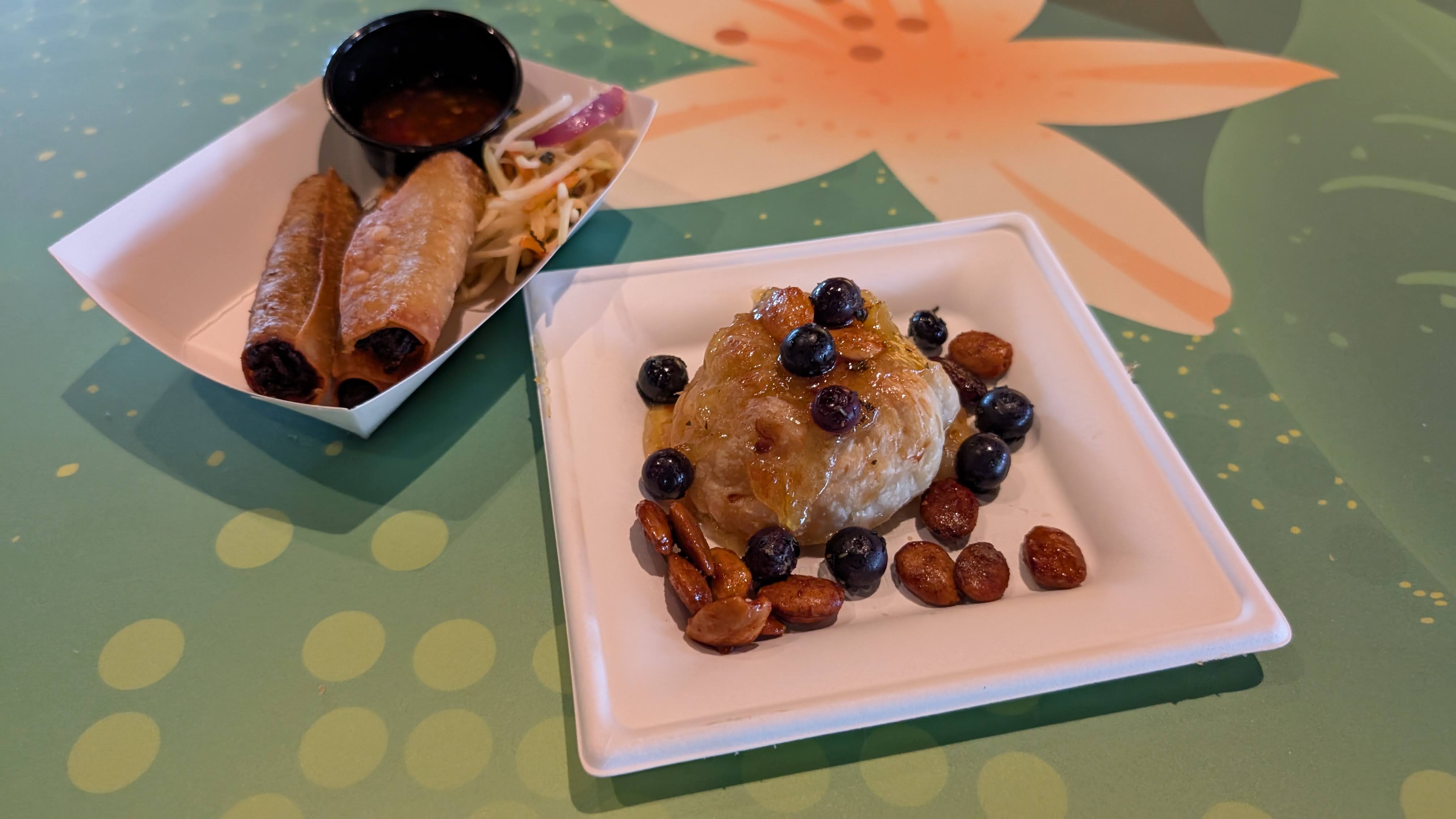 Epcot International Flower Garden Festival food The Land Cart Florida sunshine smoothie Epcot International Flower and Garden Festival food The Citrus Blossom plant based lumpia and citrus baked brie