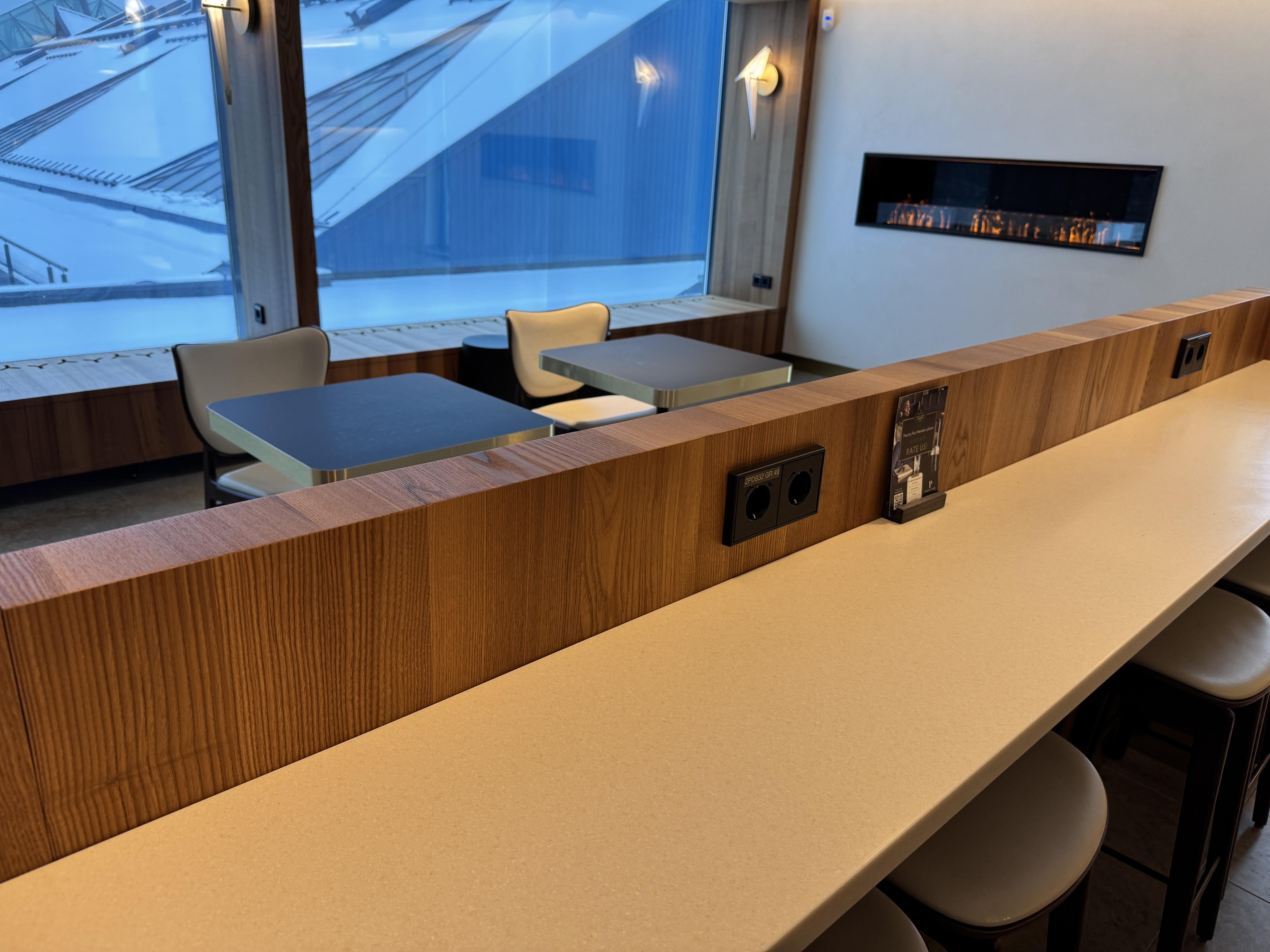 Airport Lounge by LHV TLL seating near fireplace