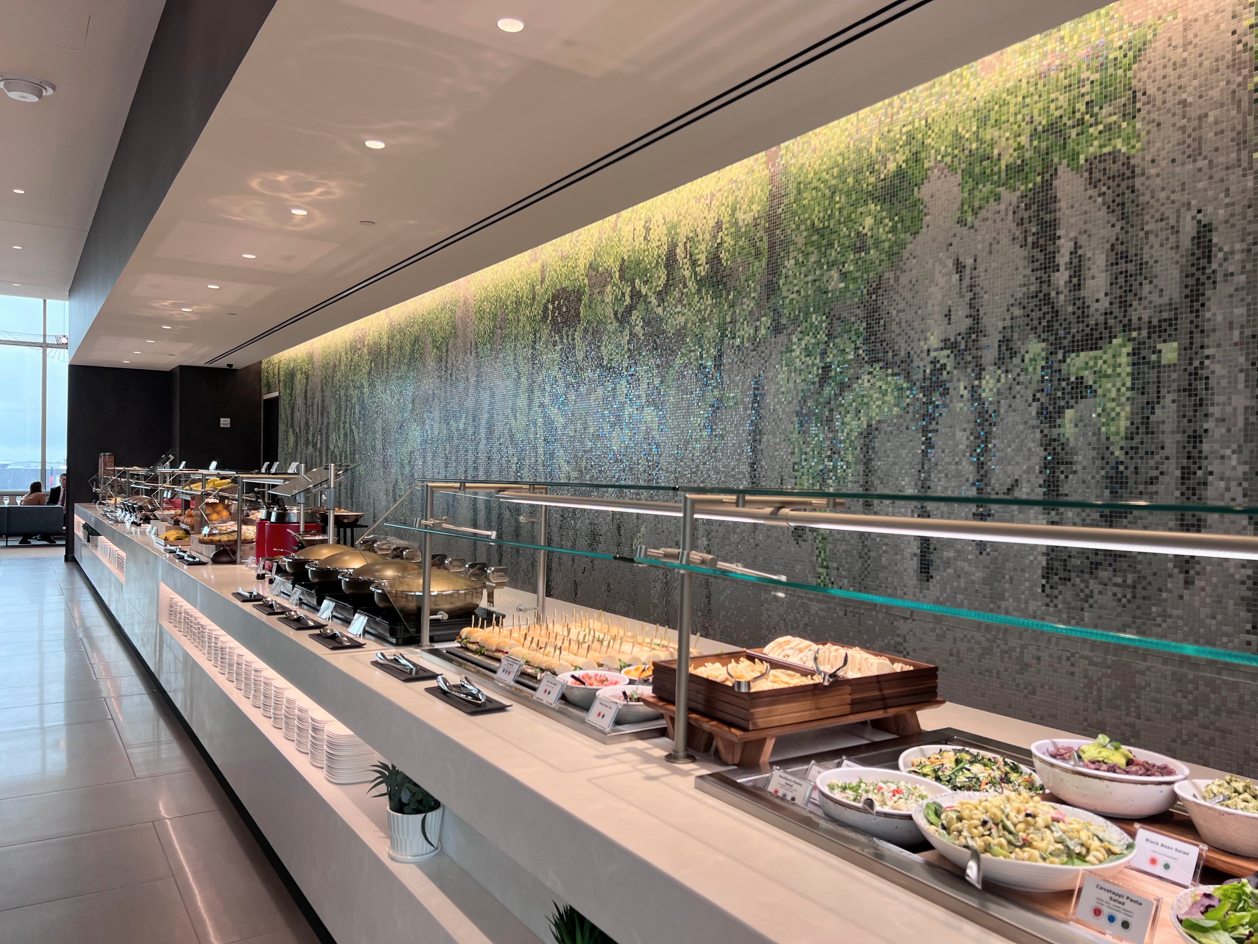 Buffet and tile mural at Atlanta Delta Sky Club