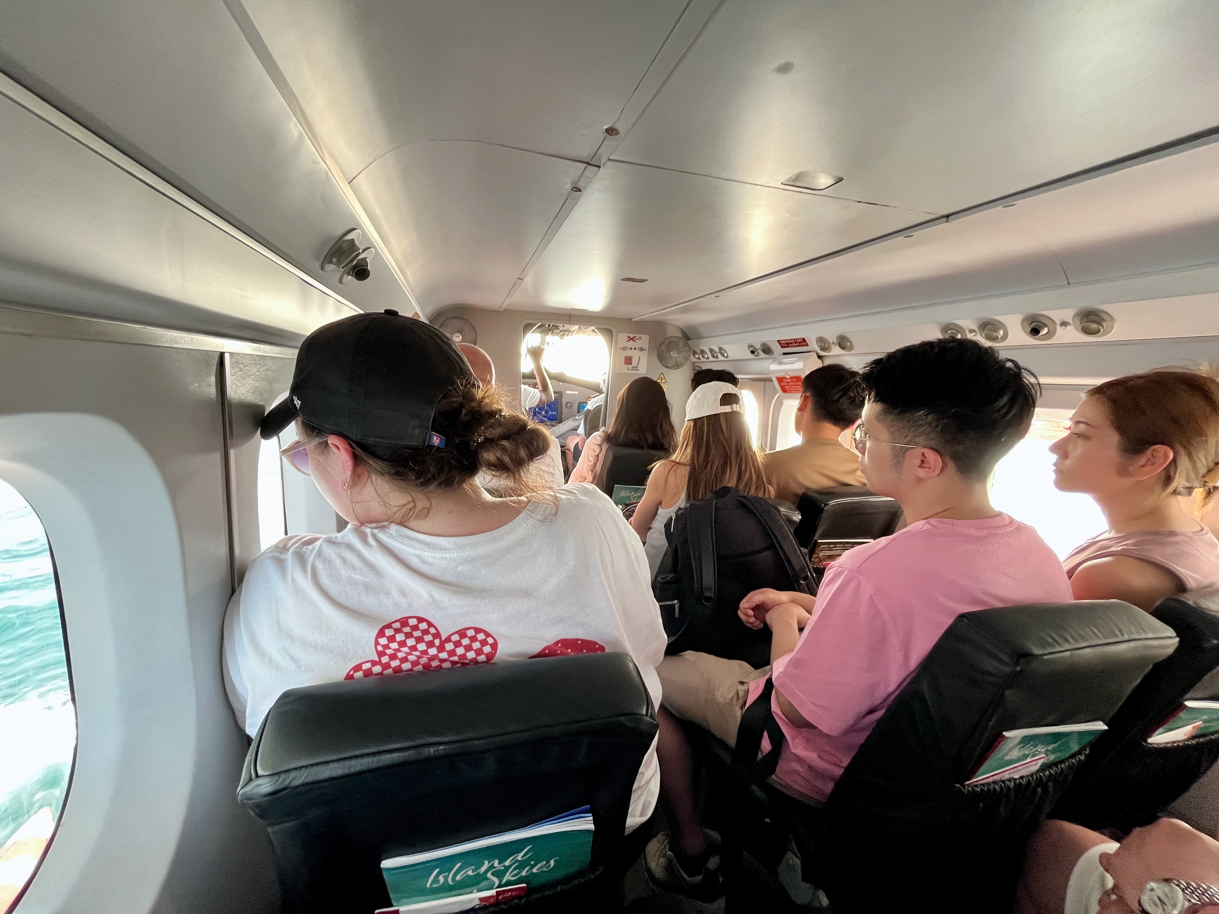 Interior of a seaplane filled with passengers