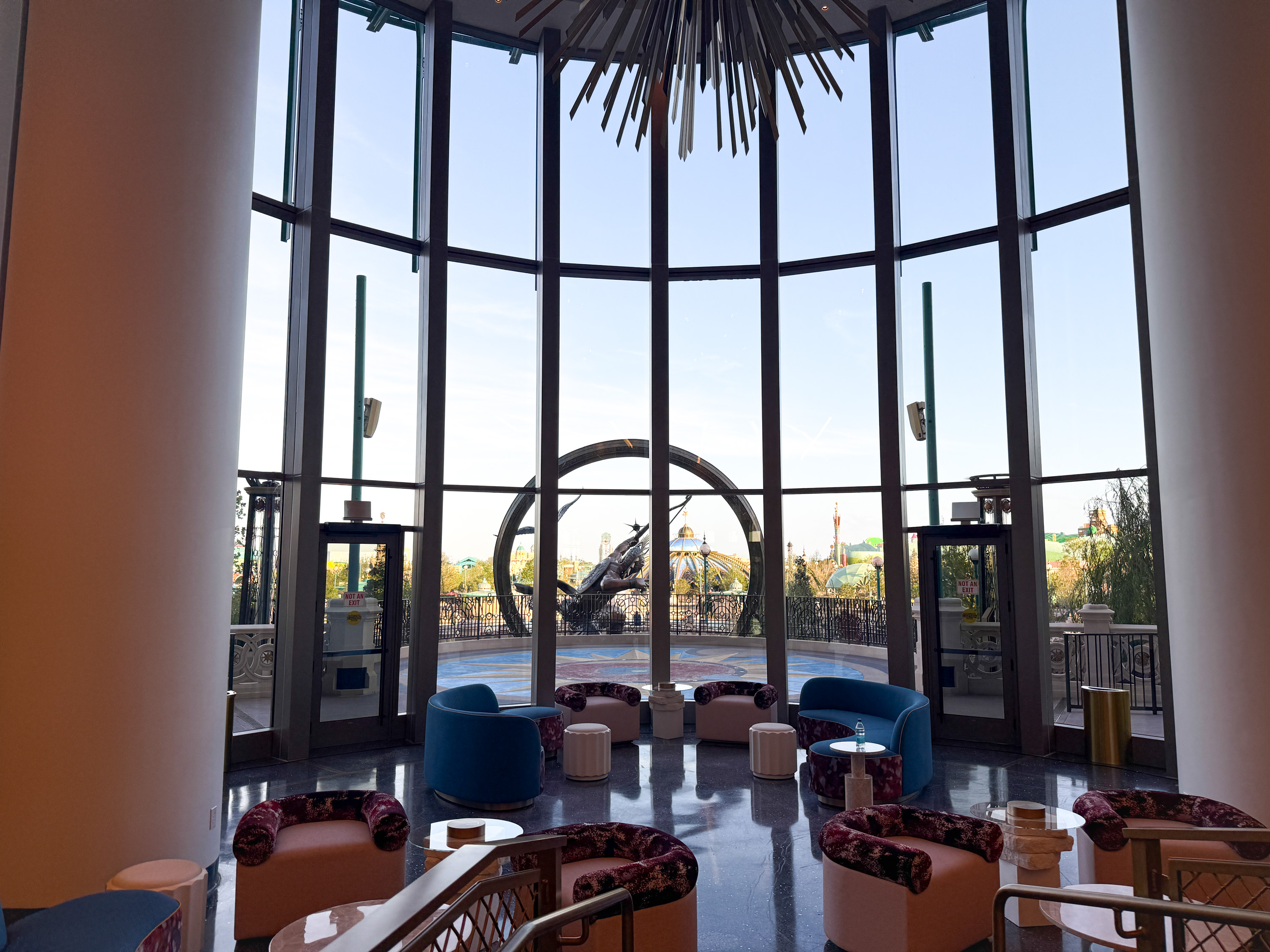 Universal Helios Grand Hotel Loews Hotel Epic Universe lobby window view Universal Helios Grand Hotel Loews Hotel Epic Universe lobby window view