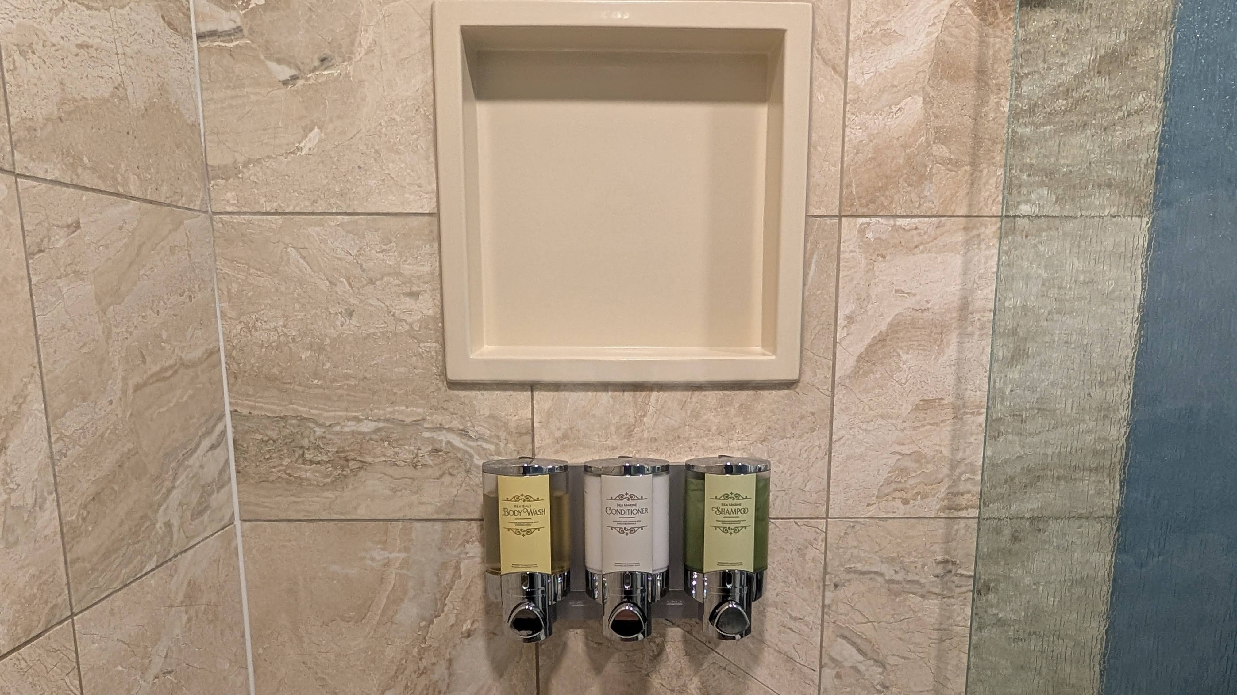 Disneys Yacht Club Resort guest room bathroom shower toiletries and shelf Disneys Yacht Club Resort guest room bathroom shower toiletries and shelf
