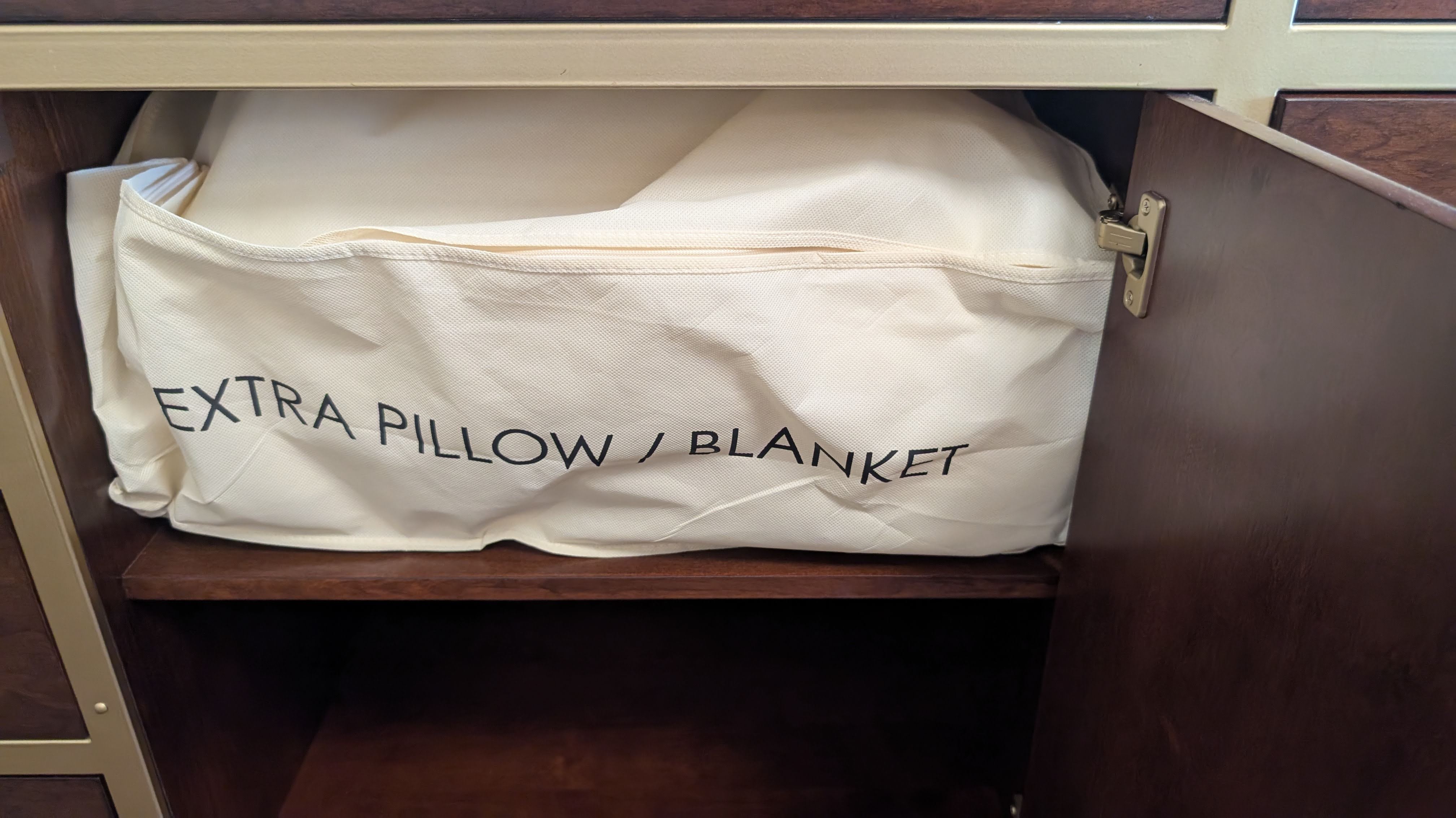 Disneys Yacht Club Resort guest room dresser extra pillow and blanket Disneys Yacht Club Resort guest room dresser extra pillow and blanket