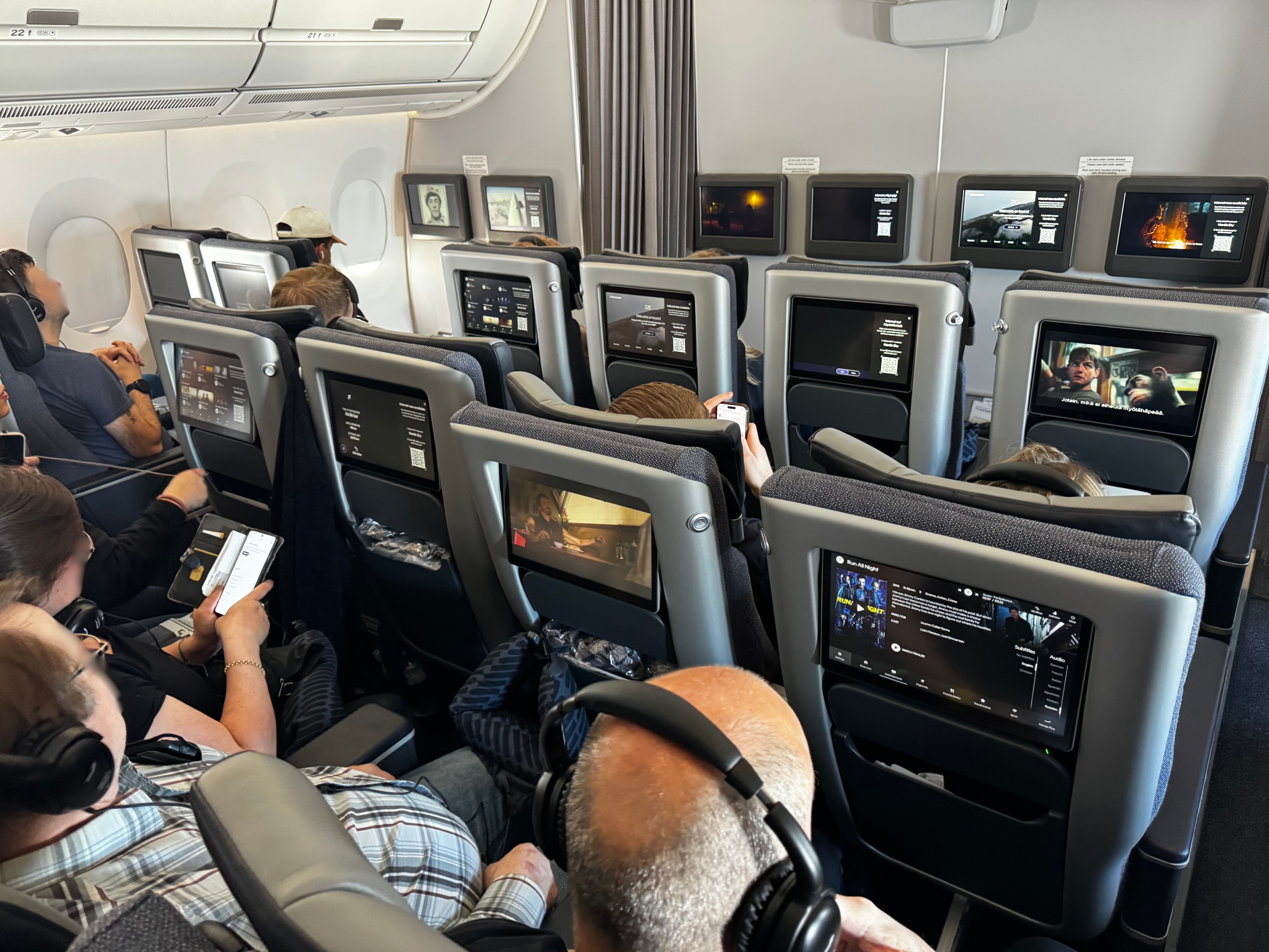 Finnair A350XWB premium economy cabin passengers blurred Finnair A350XWB premium economy cabin passengers blurred