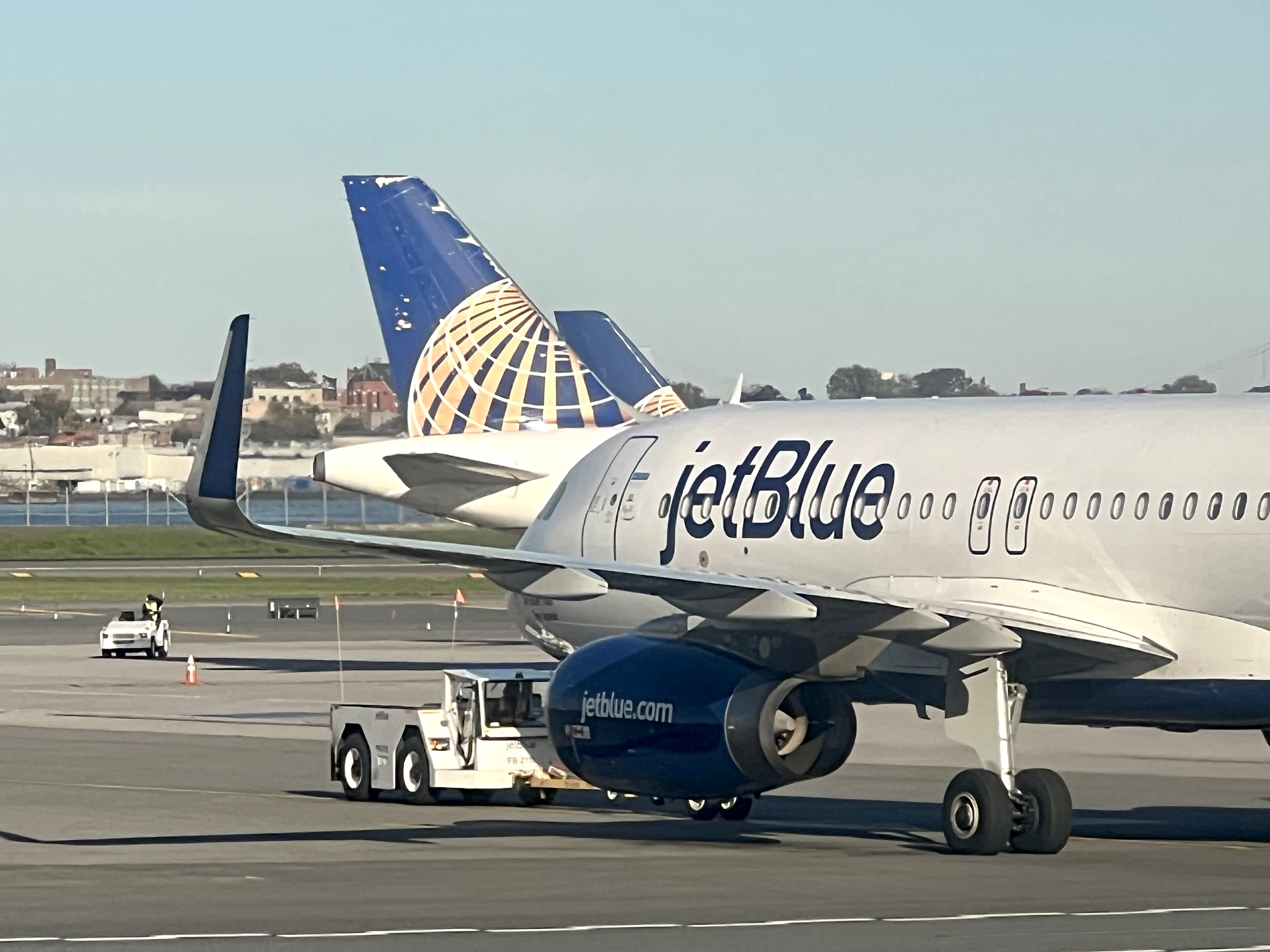 JetBlue and United jets at La Guardia New York LGA JetBlue and United jets at La Guardia New York LGA