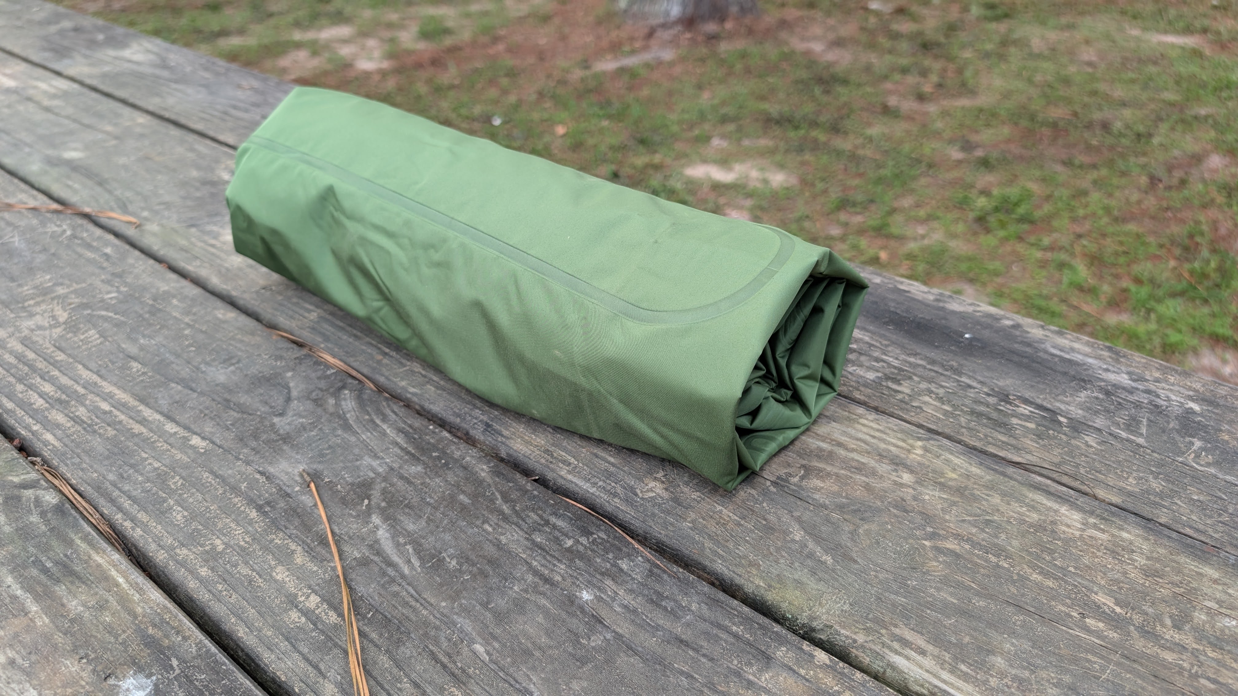 Self inflating sleeping pad rolled up