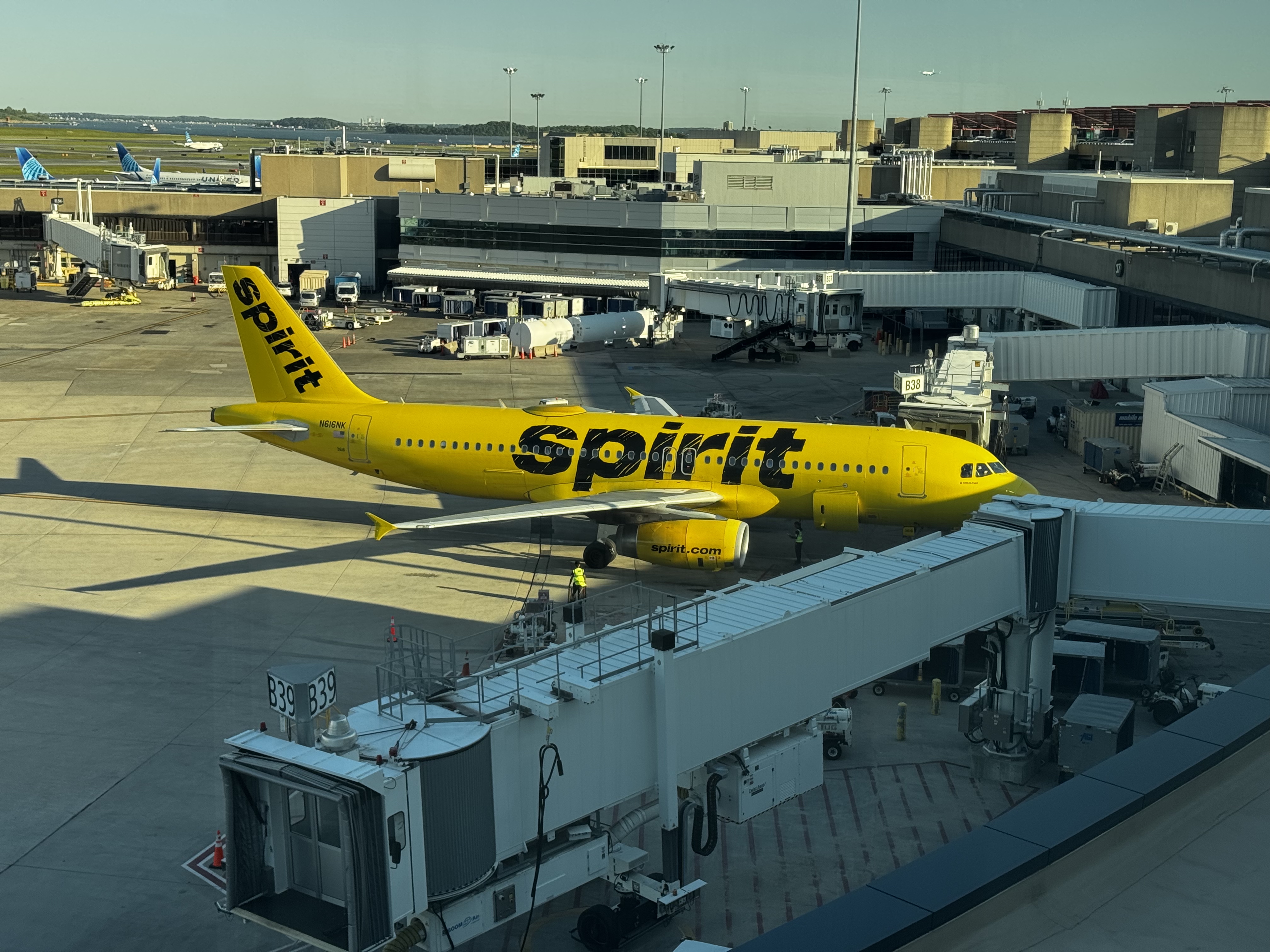 Spirit Airlines A320 plane at gate BOS airport Spirit Airlines A320 plane at gate BOS airport