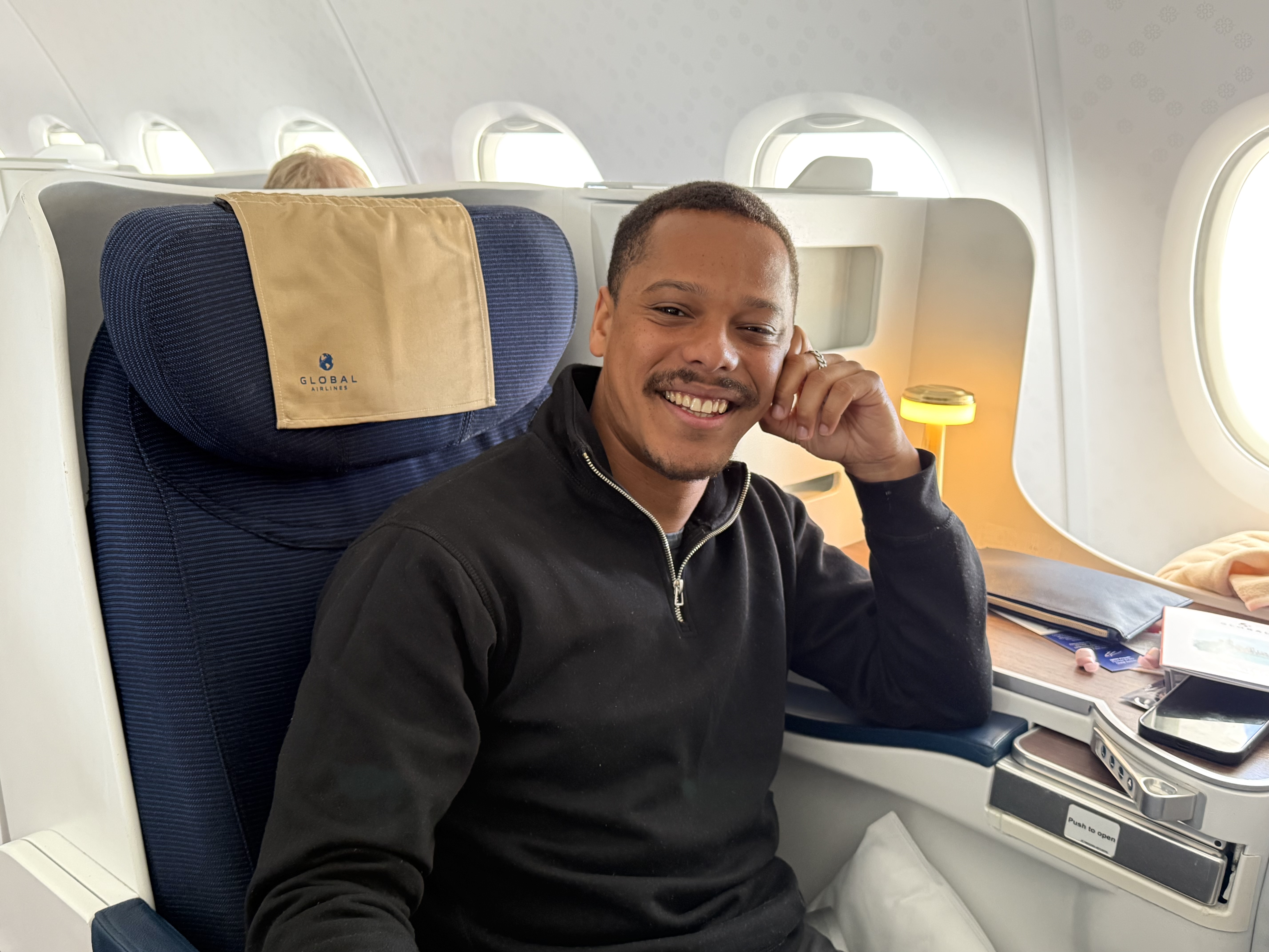 Travis enjoying his Global business class experience