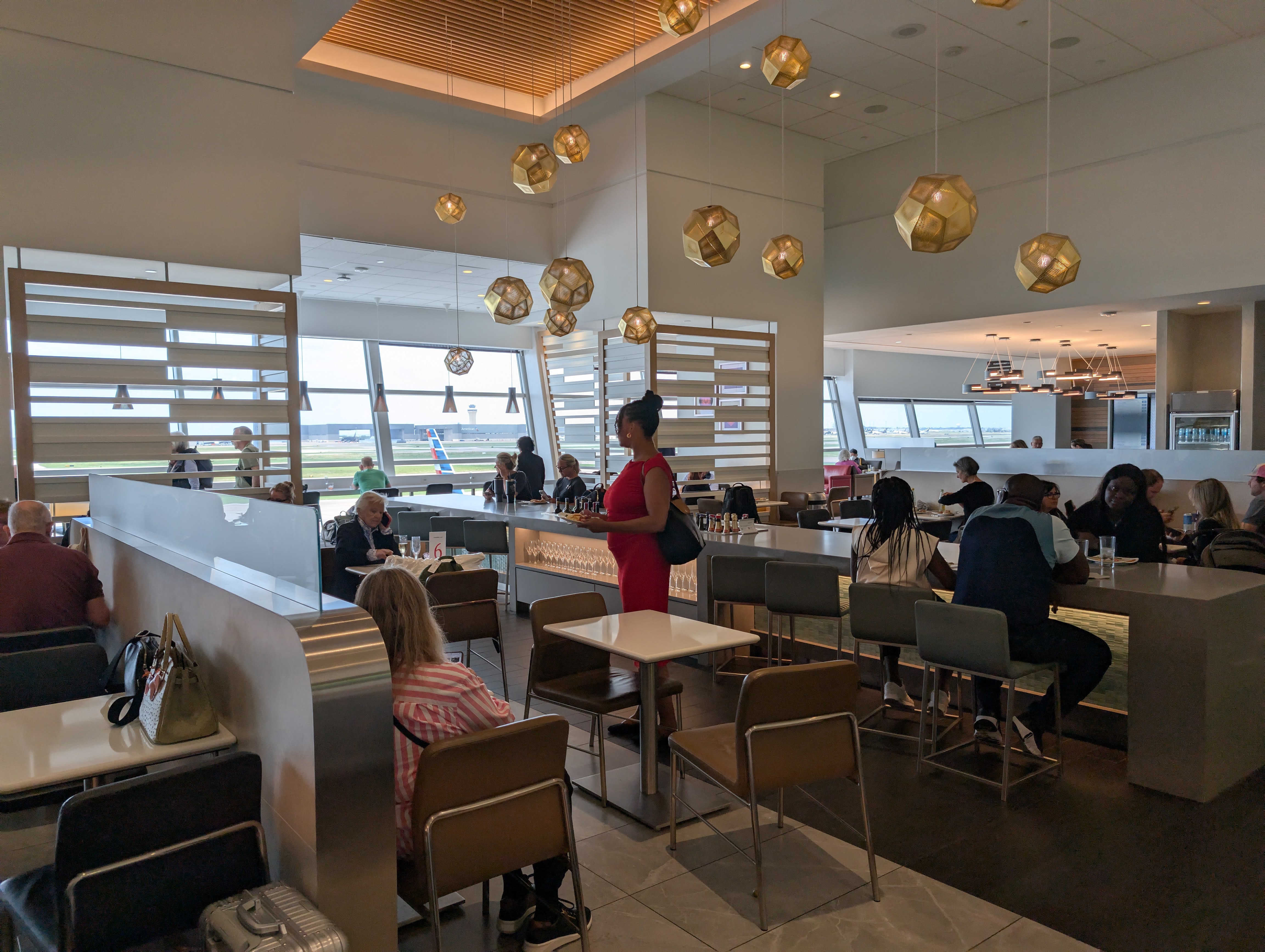 American Airlines Flagship Lounge DFW main buffet area from seating American Airlines Flagship Lounge DFW main buffet area from seating