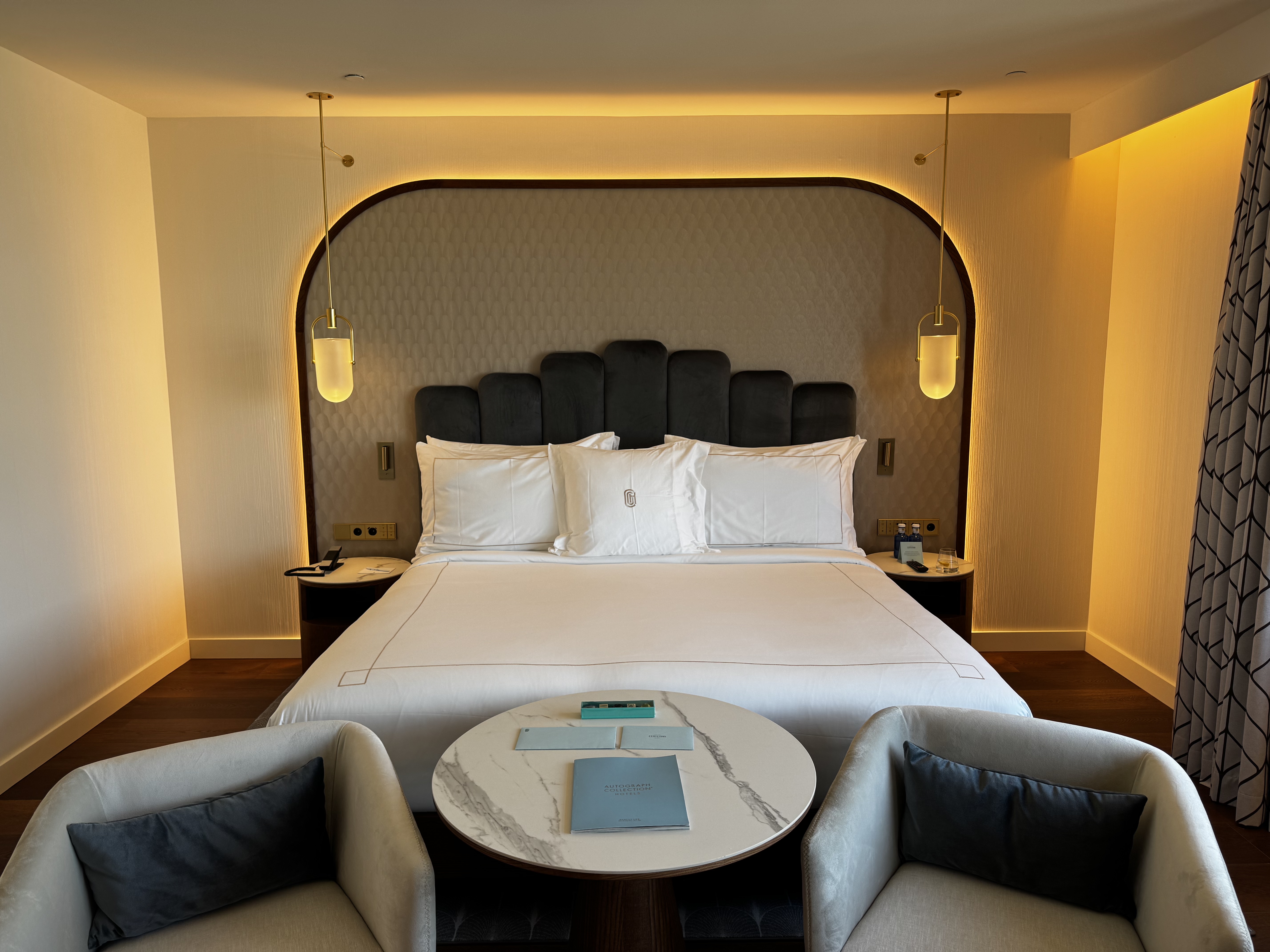 Grand Hotel Centenari Valencia Marriott Autograph Collection bedroom bed chairs