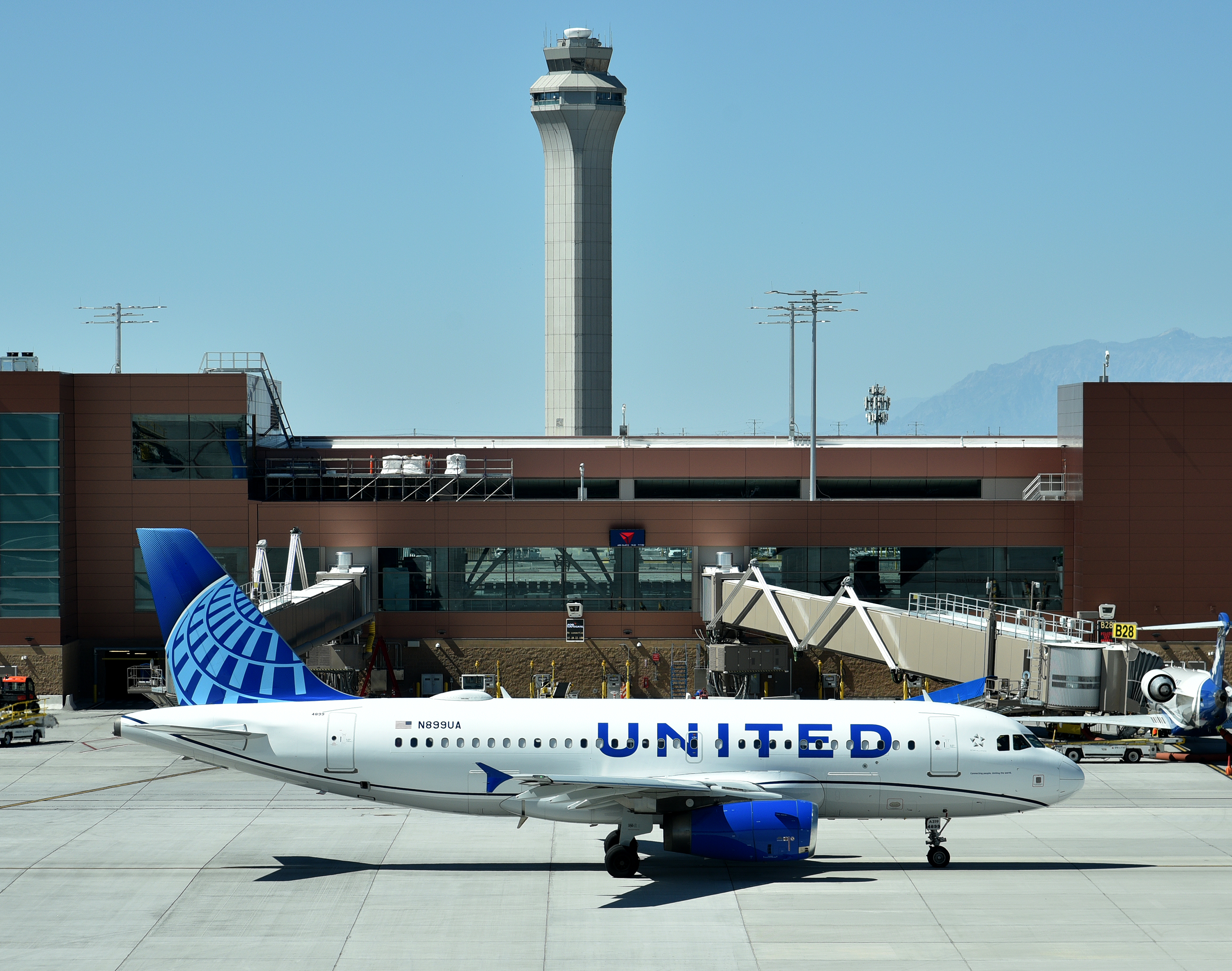 United CR700 Economy Class United Airlines A319 taxiing SLC control tower