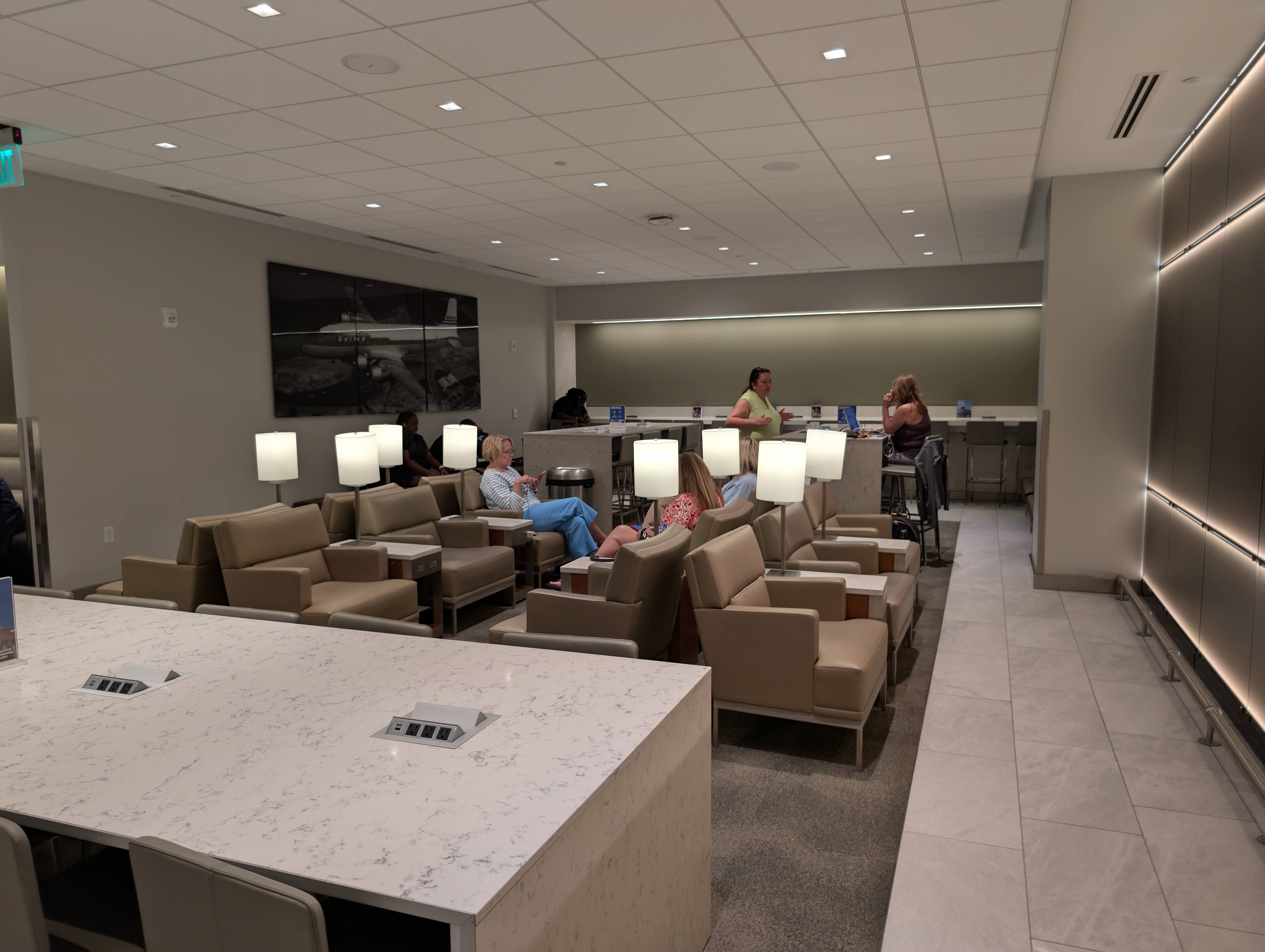 United Club FLL seating bar and armchairs