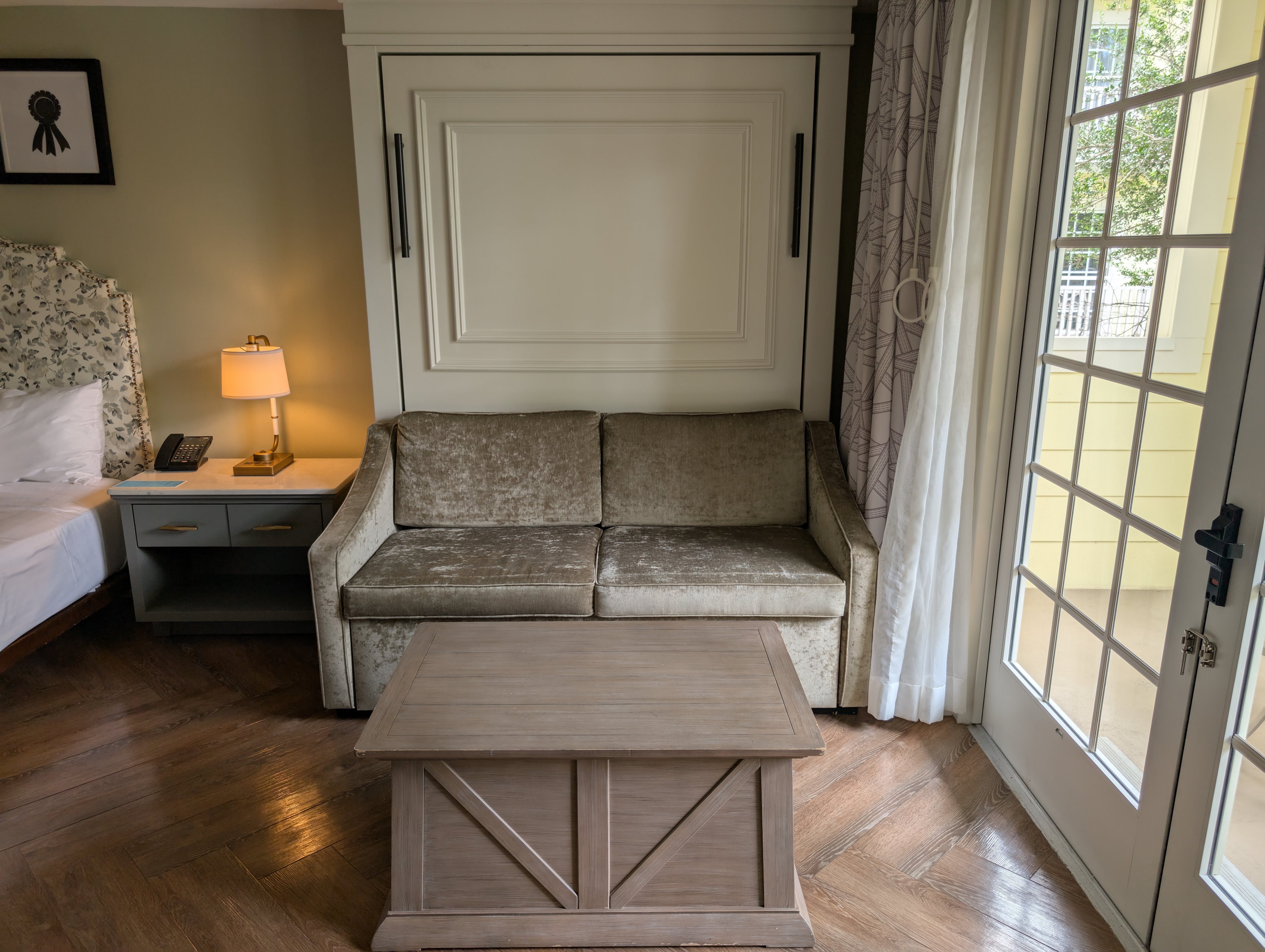 Disney’s Saratoga Springs Resort & Spa room day sofa with adjustable table Disney's Saratoga Springs Resort & Spa room day sofa with adjustable table