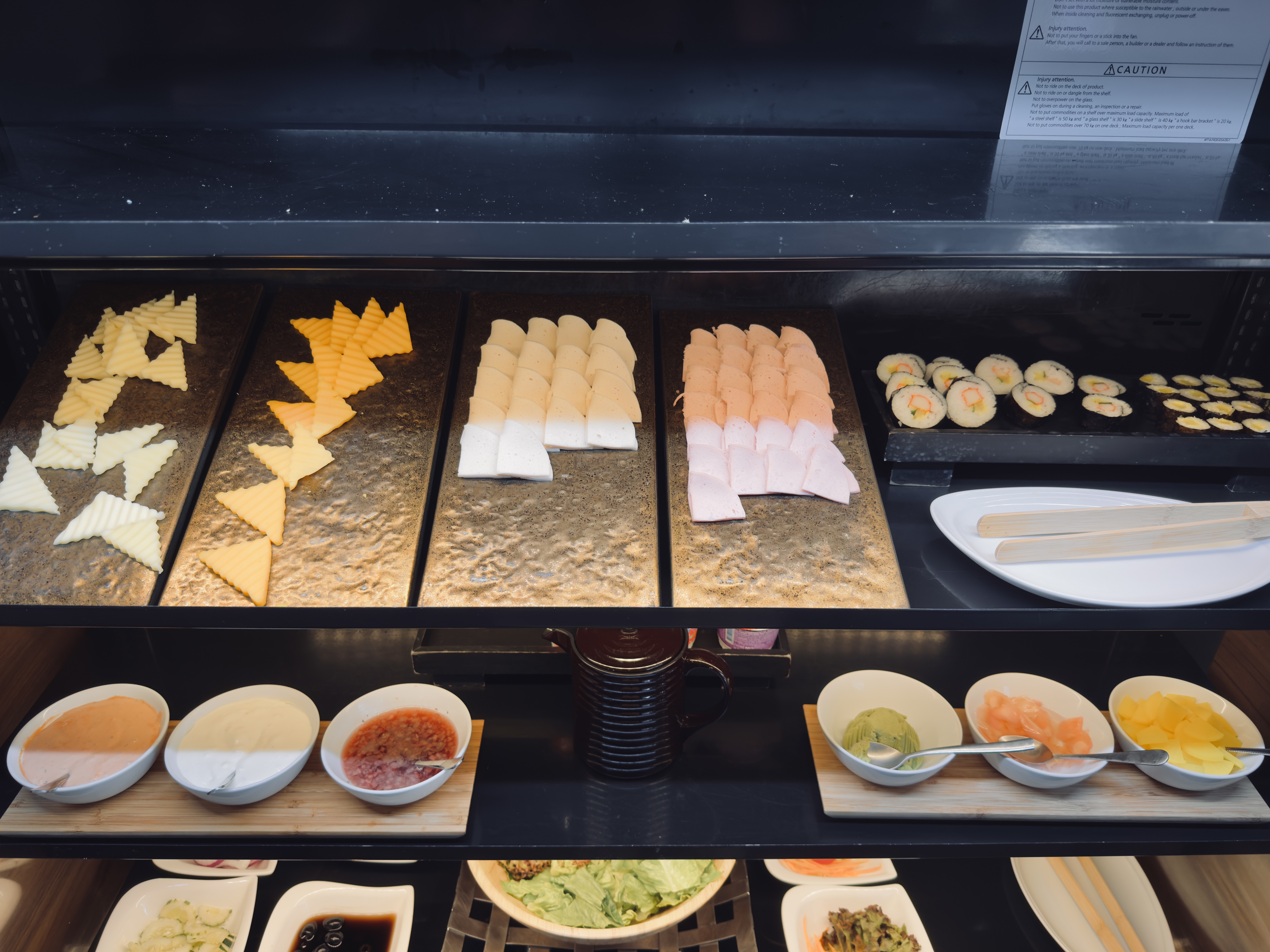 Metropolis Suites Bangkok cold cuts and sushi