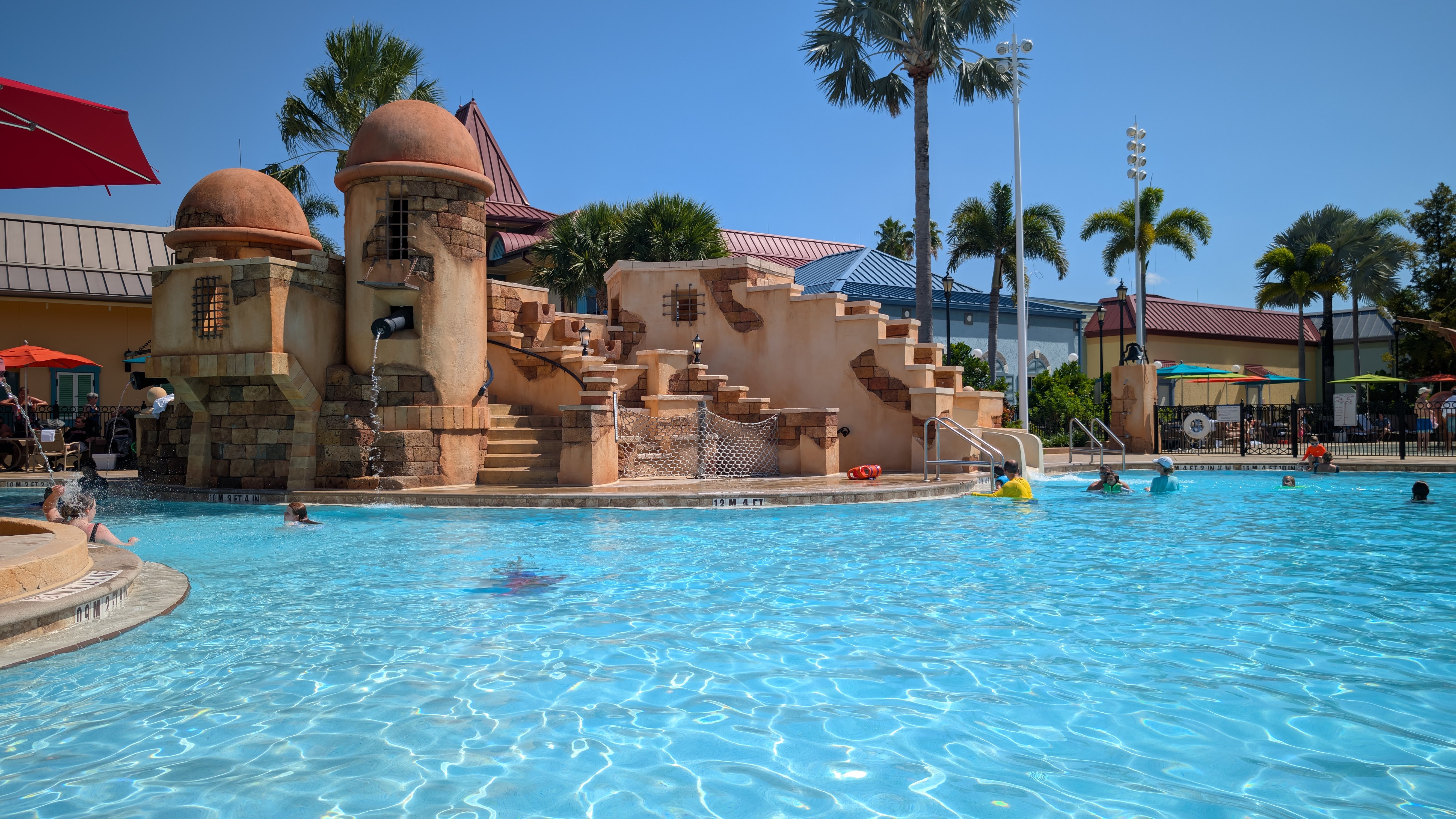 Disney’s Caribbean Beach Resort Fuentes del Morro feature pool slide Disney's Caribbean Beach Resort Fuentes del Morro feature pool slide