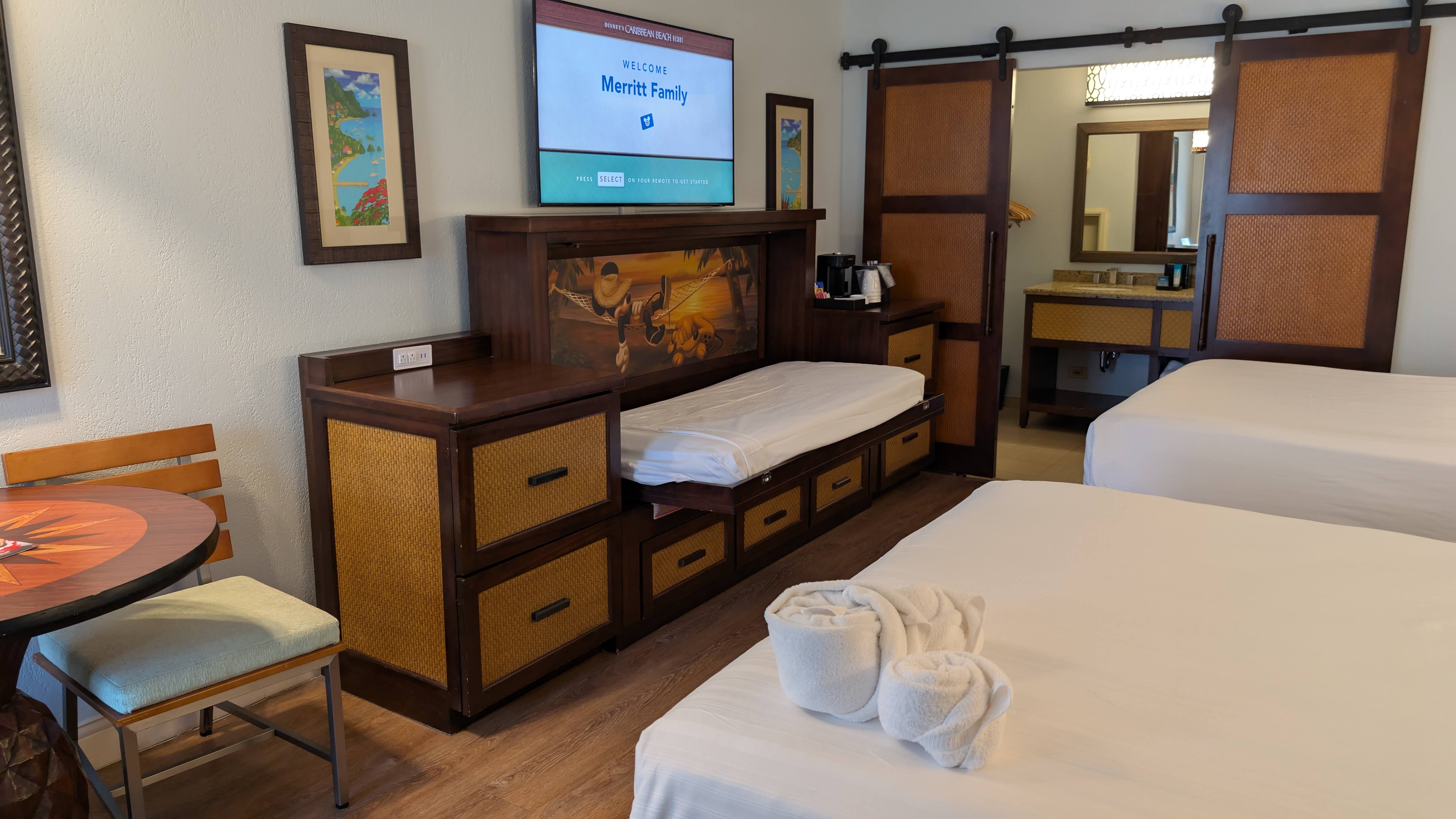 Disney’s Caribbean Beach Resort guest room with a pull down bed Disney's Caribbean Beach Resort guest room with a pull down bed