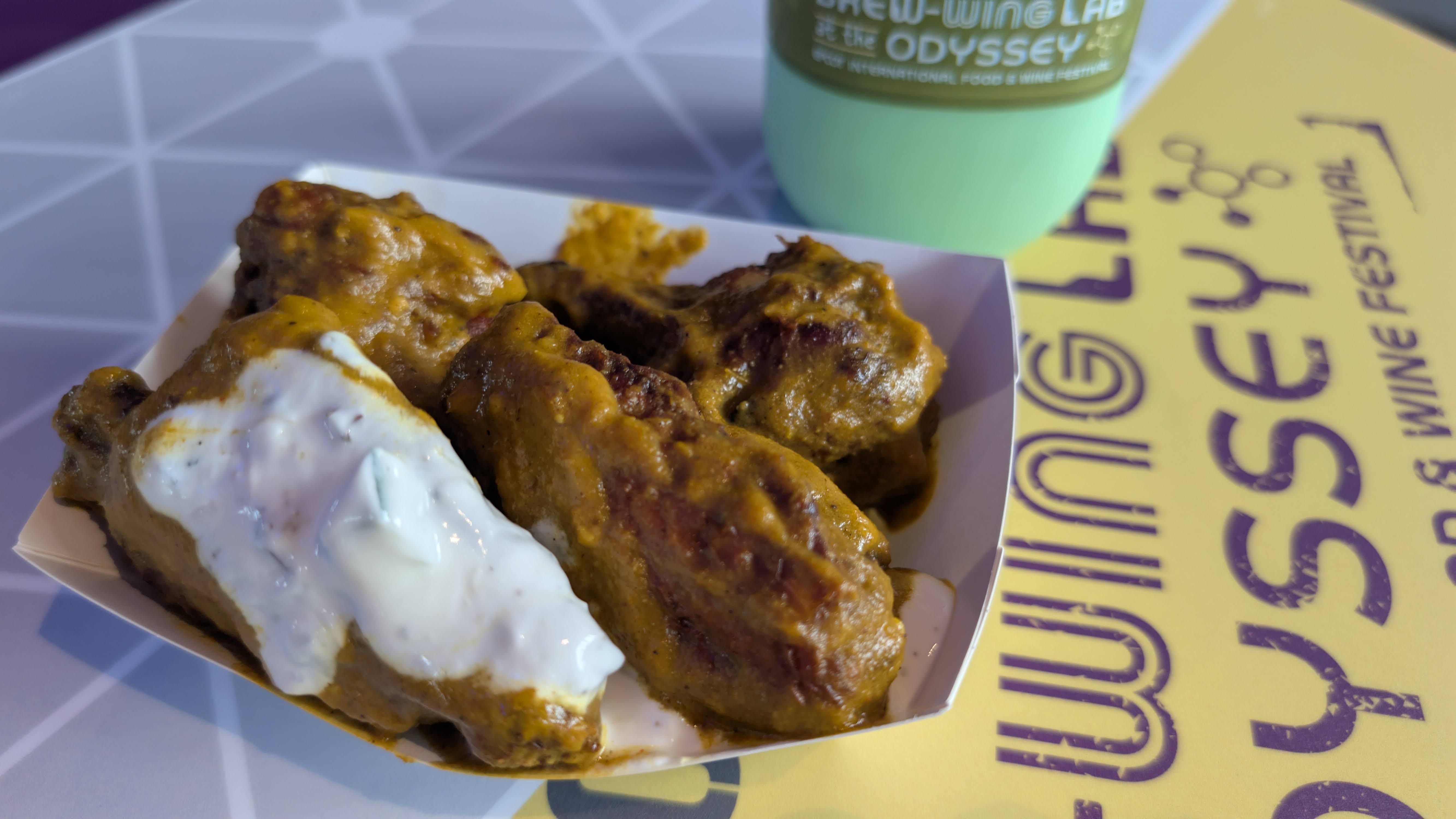 EPCOT Food & Wine Festival 2025 Brew Wing Lab unnecessarily spicy yet extremely tasty carolina reaper pepper curry wings EPCOT Food & Wine Festival 2025 Brew Wing Lab unnecessarily spicy yet extremely tasty carolina reaper pepper curry wings