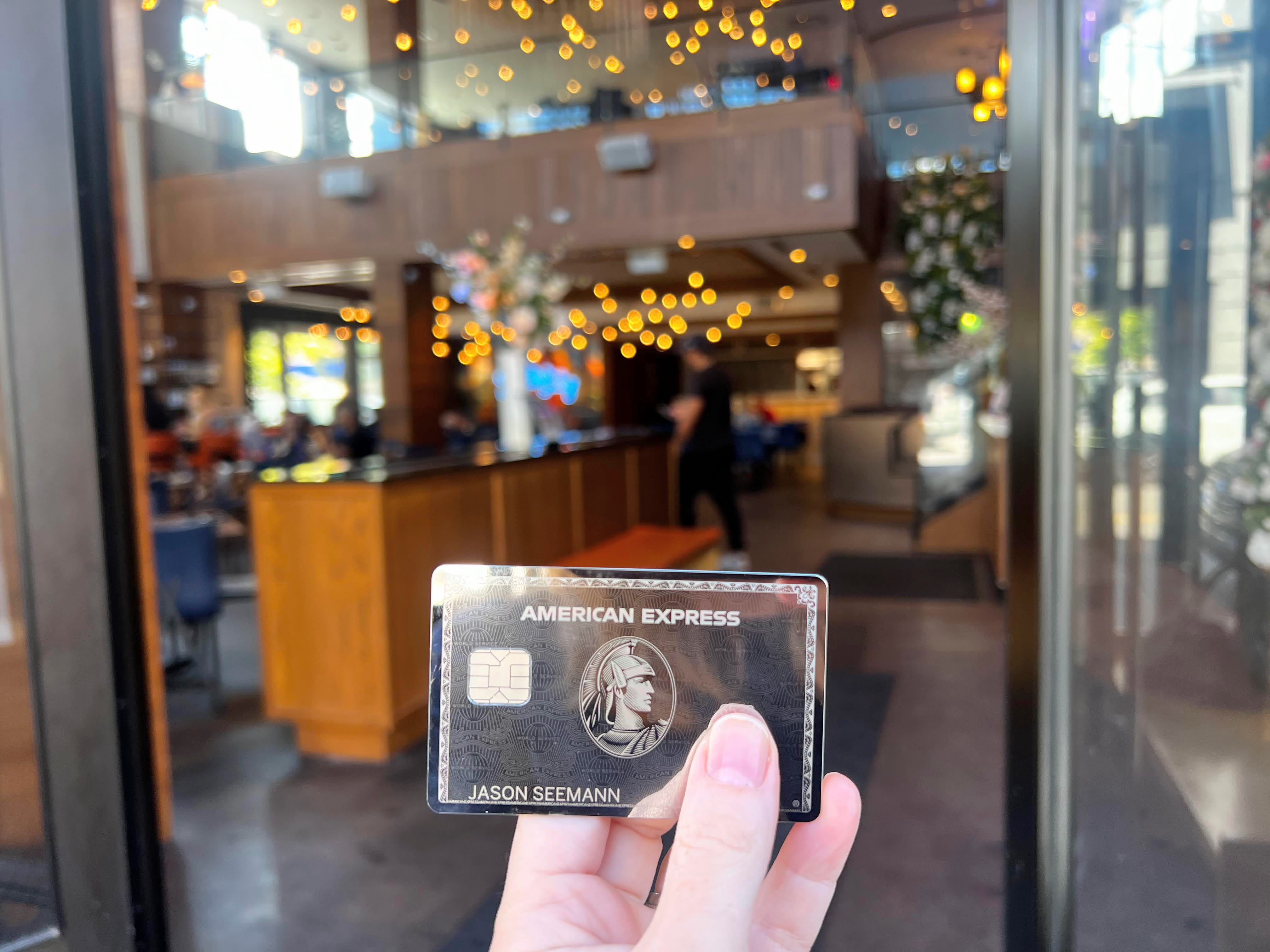 Amex Platinum mirror card in front of Resy restaurant Amex Platinum mirror card in front of Resy restaurant