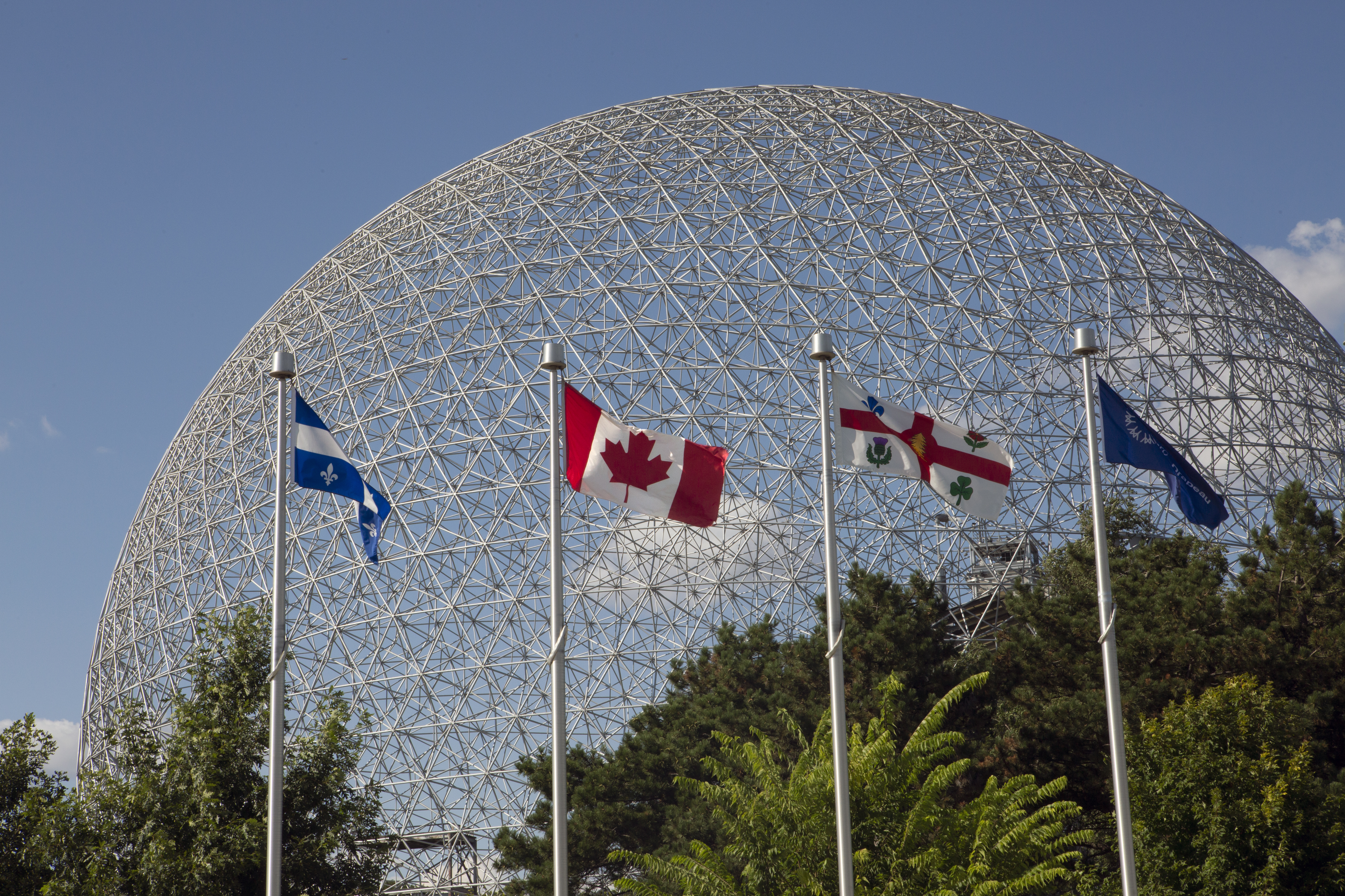 Montreal, Quebec, island skyline Montreal Canada flags Biosphere exterior