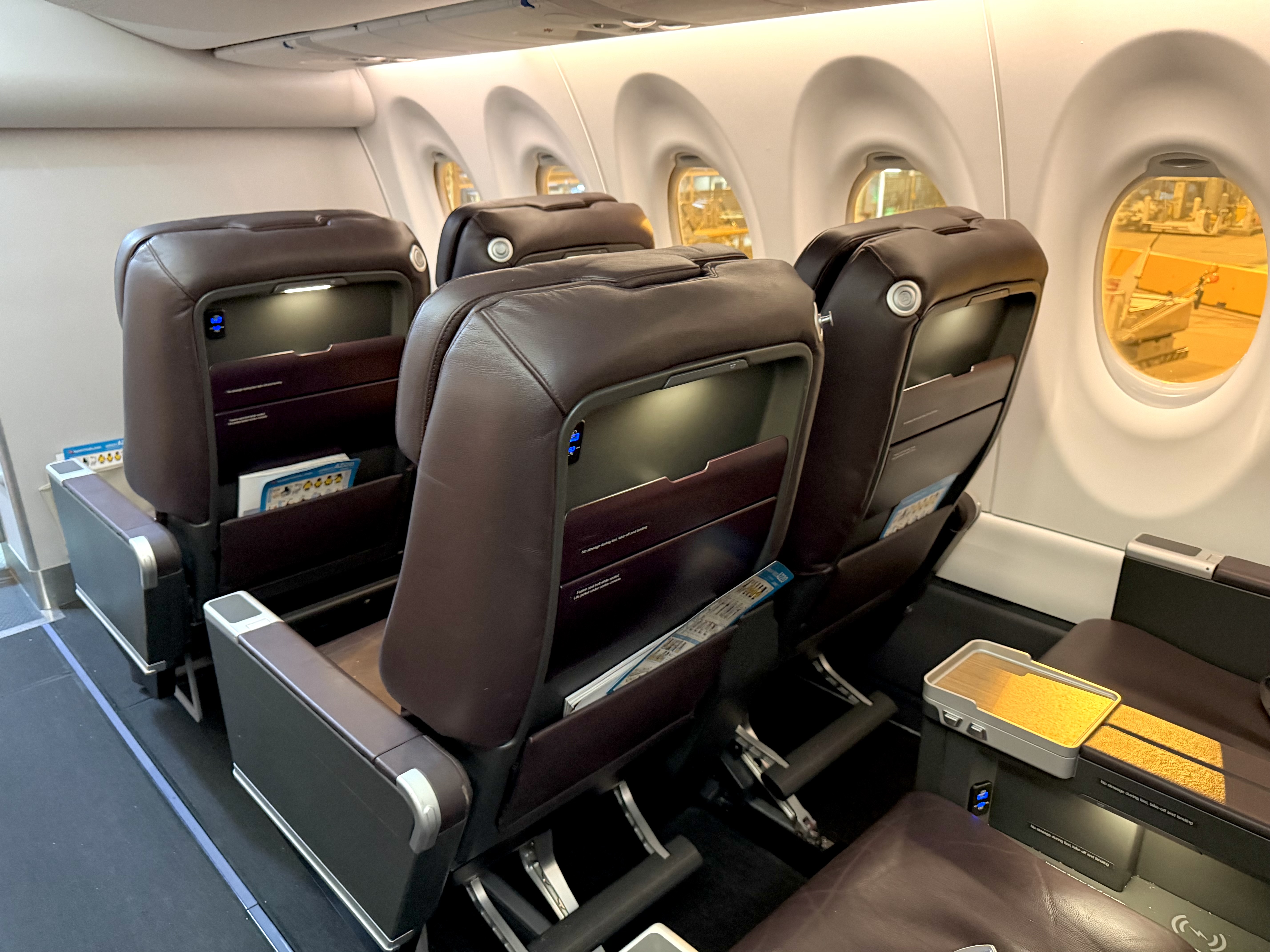 Qantas Airbus A220 business class seats from behind Qantas Airbus A220 business class seats from behind