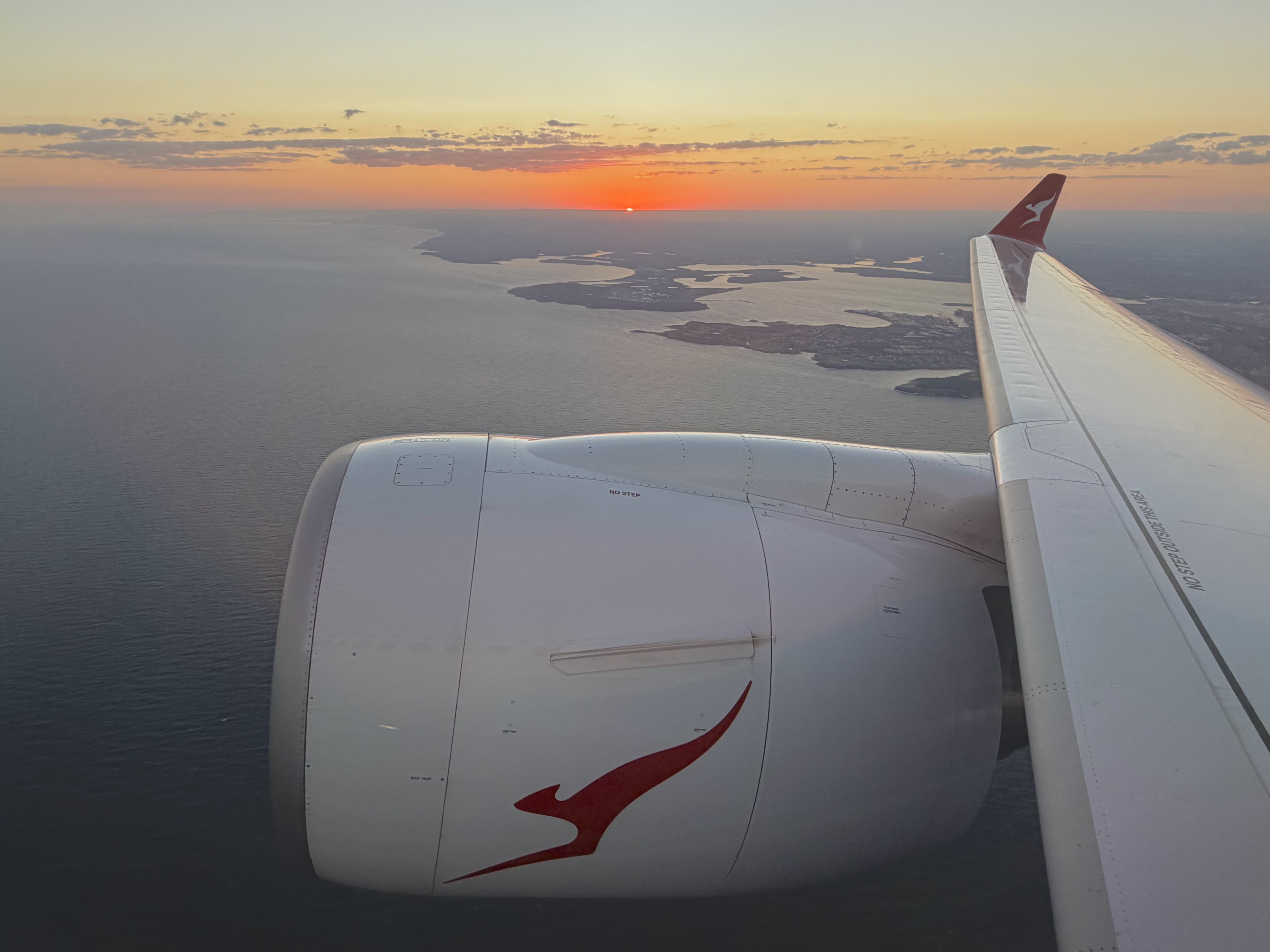 Qantas Airbus A220 wing and engine on take off from Sydney SYD Qantas Airbus A220 wing and engine on take off from Sydney SYD