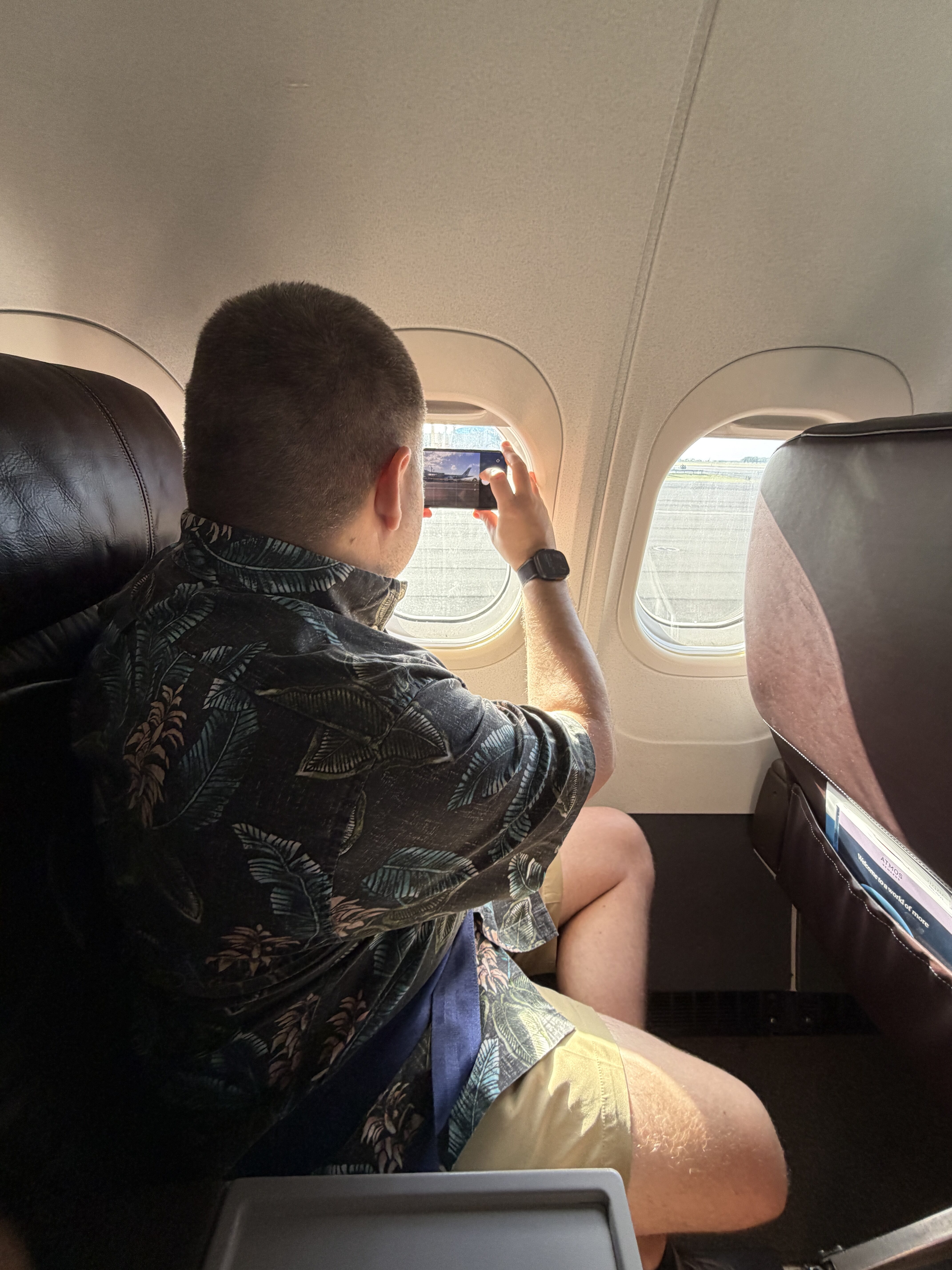 Taking a Picture Out the Window Hawaiian Airlines Taking a Picture Out the Window Hawaiian Airlines