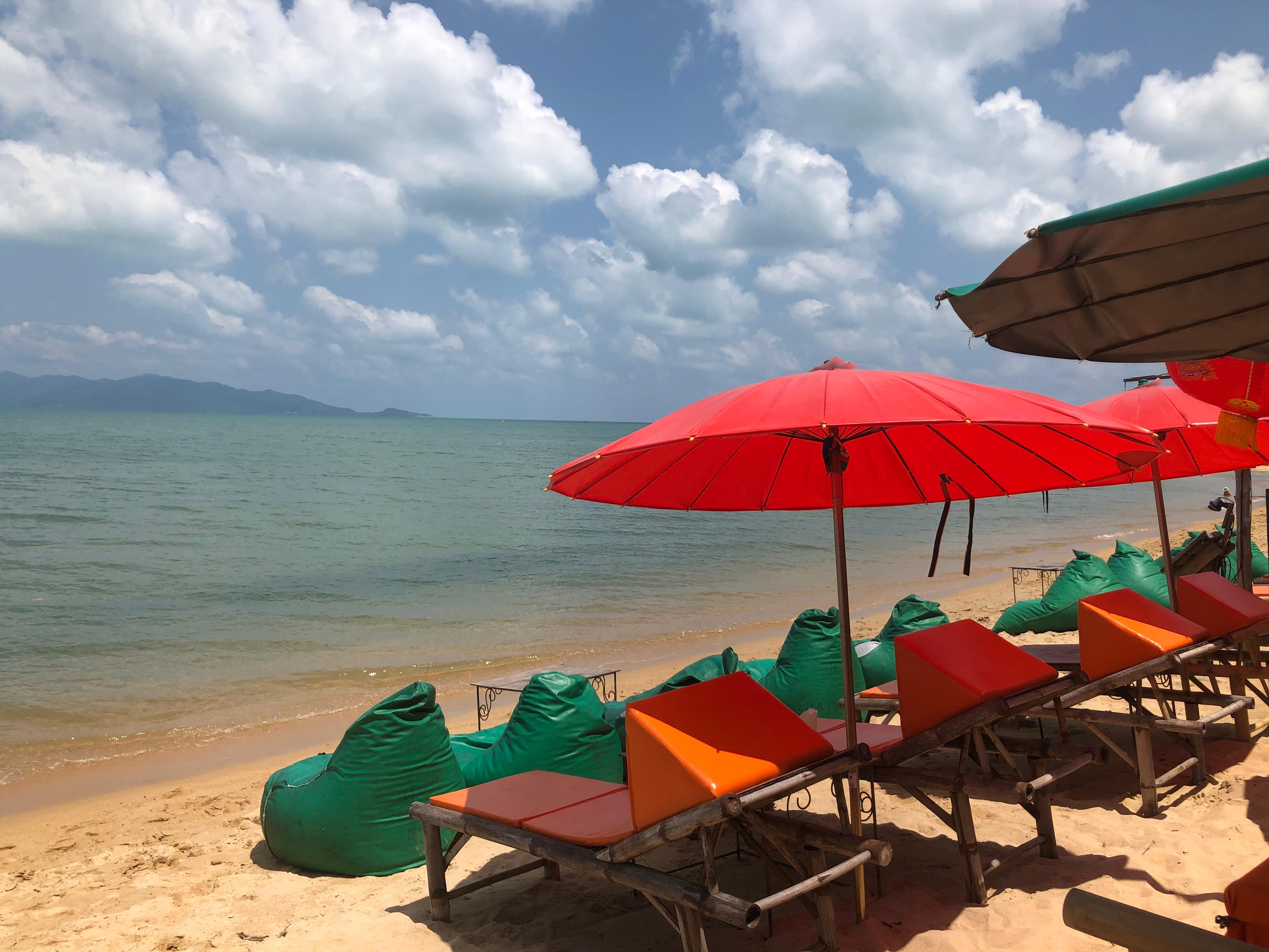 Beach in Koh Samui with chairs and umbrellas