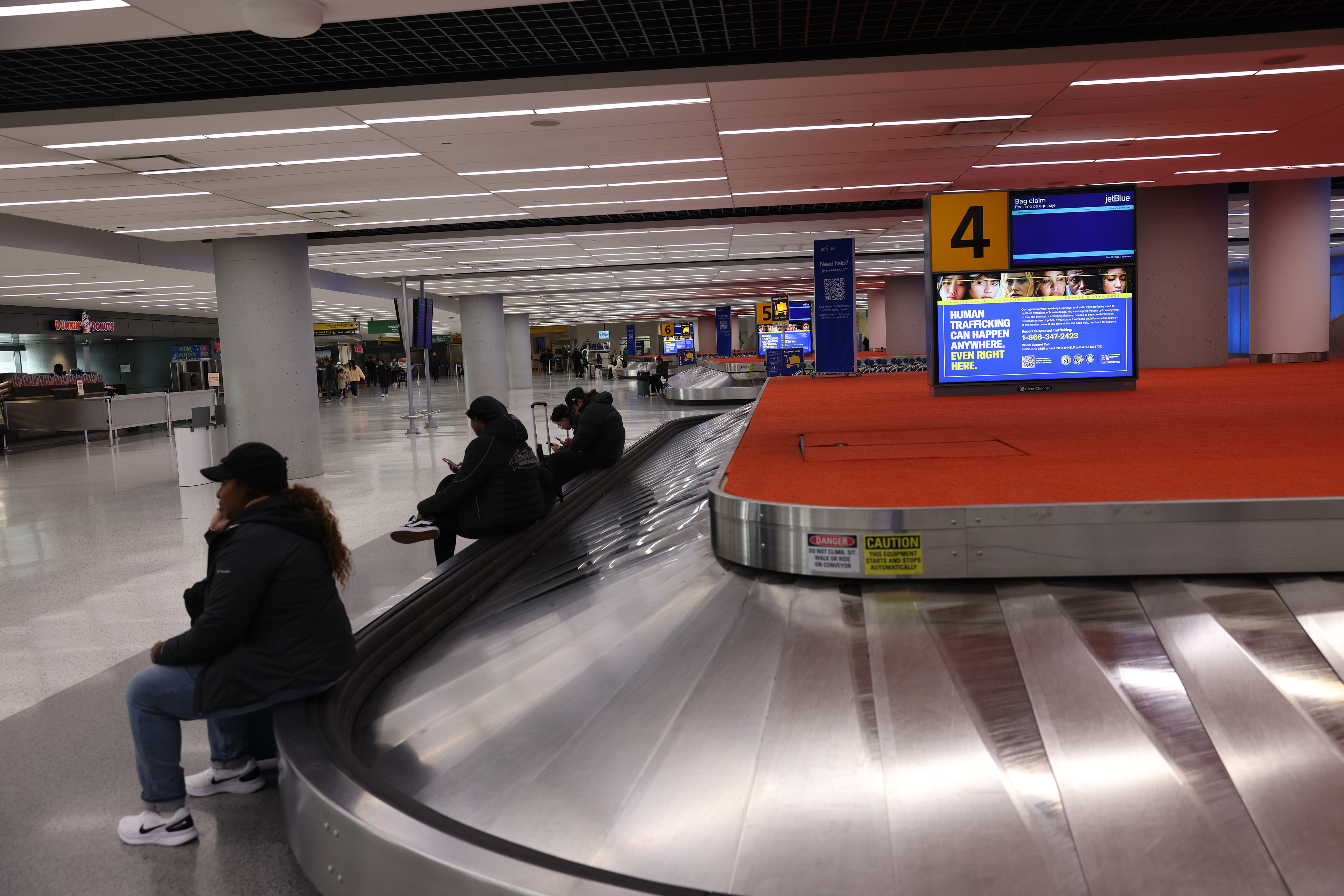 3 baggage carousel 4 JFK Terminal 5.jpg people sitting sm