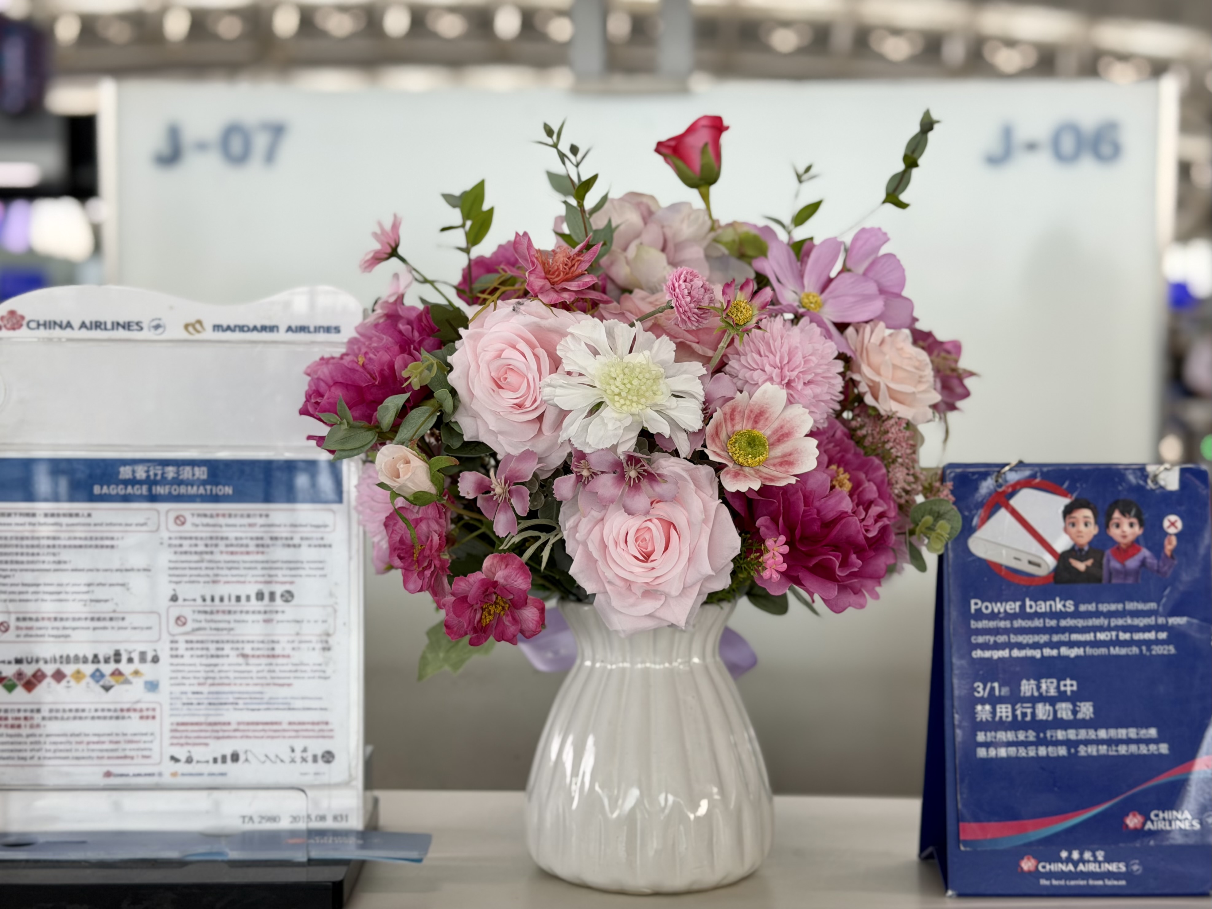 China Airlines check in desk flowers