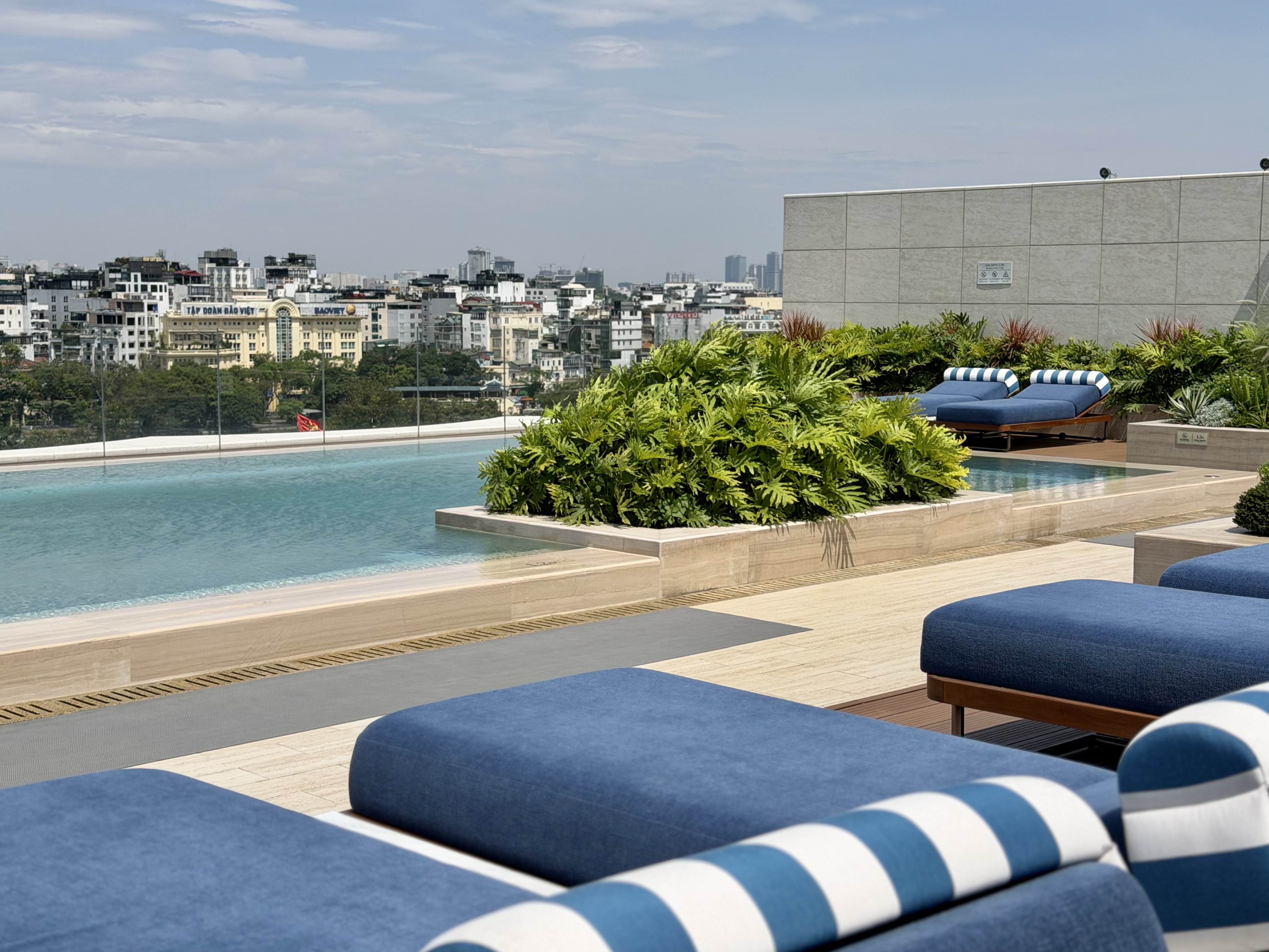 Fairmont Hanoi rooftop pool with sunbeds